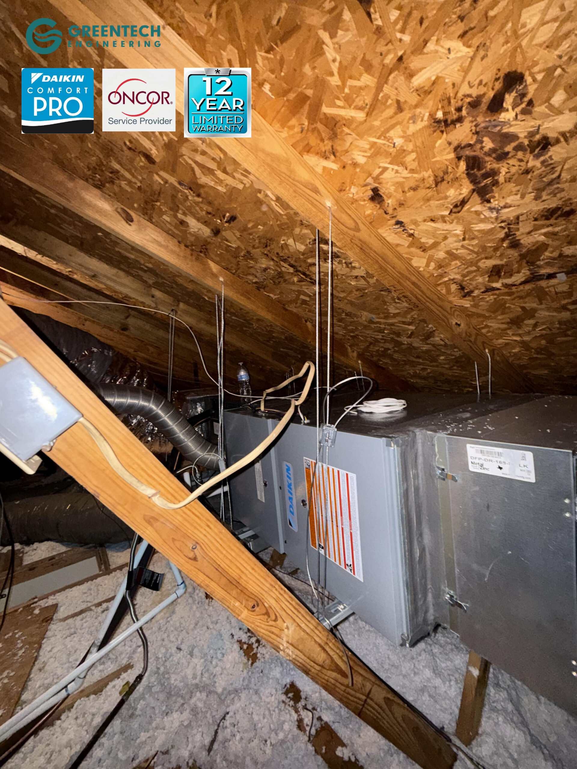 A pristine installation of a Daikin gas furnace and cased coil suspended in an attic with new metal plenums and R-8 flex ductwork.