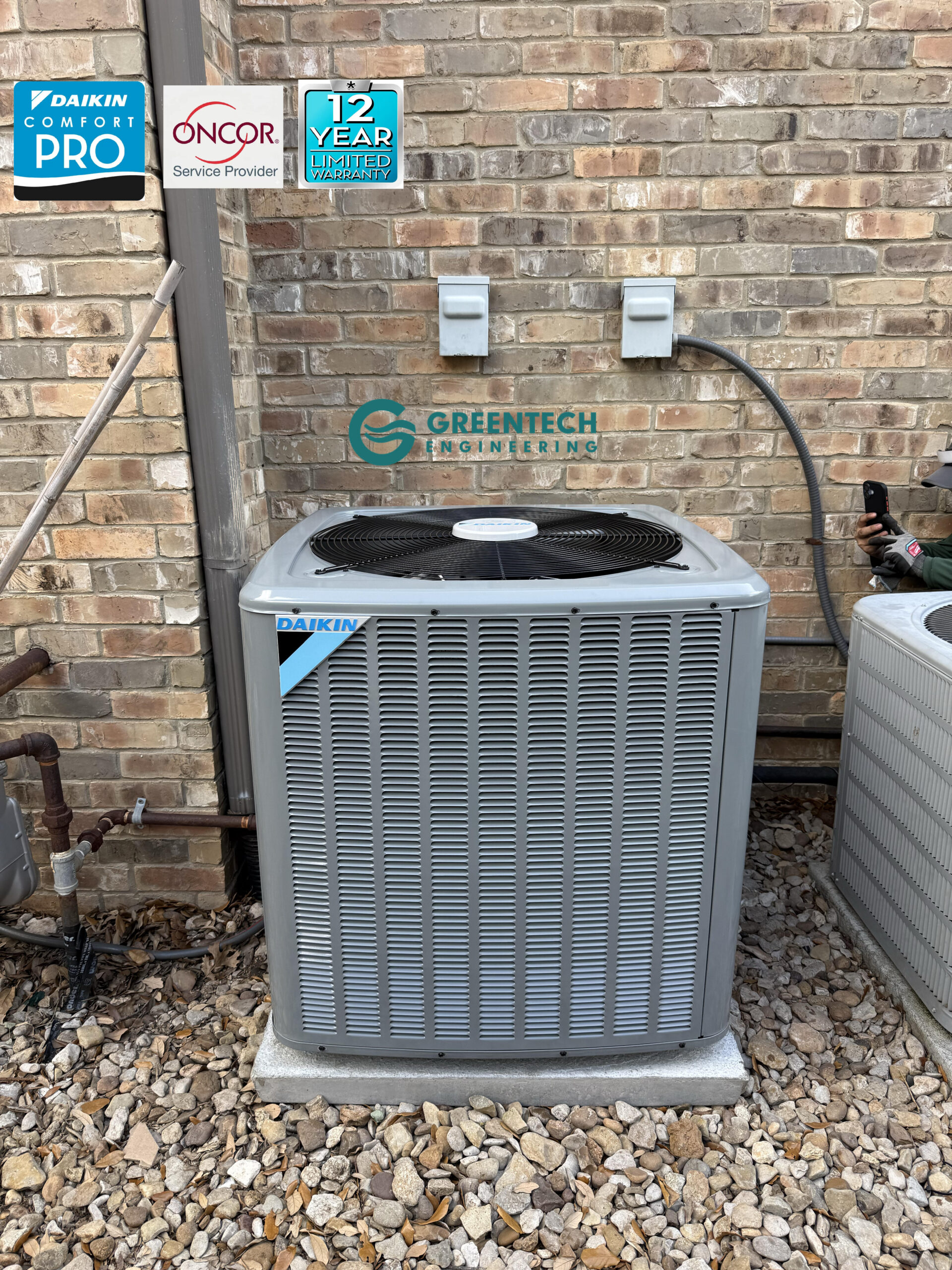A sleek, brand-new Daikin variable-speed AC condenser installed on a leveled concrete pad outside a brick home in Plano, TX, featuring Daikin Comfort Pro and Oncor Authorized Provider badges.