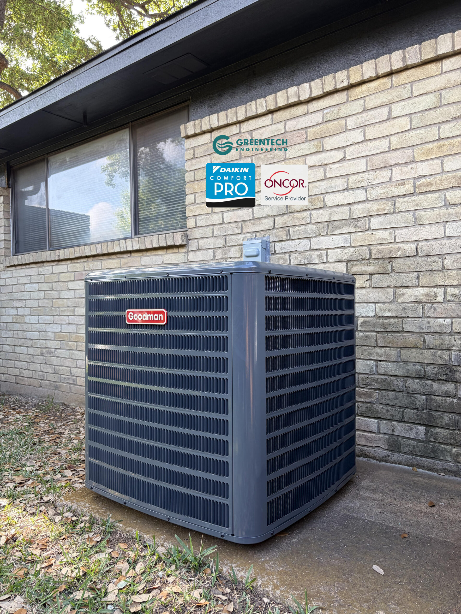 A newly installed, high-efficiency Goodman 4-Ton air conditioner condenser sitting perfectly leveled outside a brick home in Plano, TX, featuring Greentech Engineering and Oncor Authorized Provider badges.
