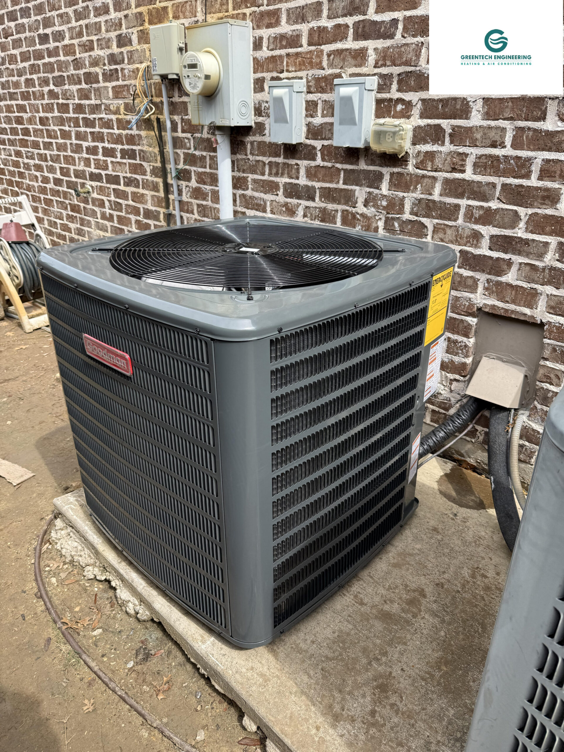 Newly installed high-efficiency Goodman 4-Ton AC condenser on a new concrete equipment pad in Little Elm.