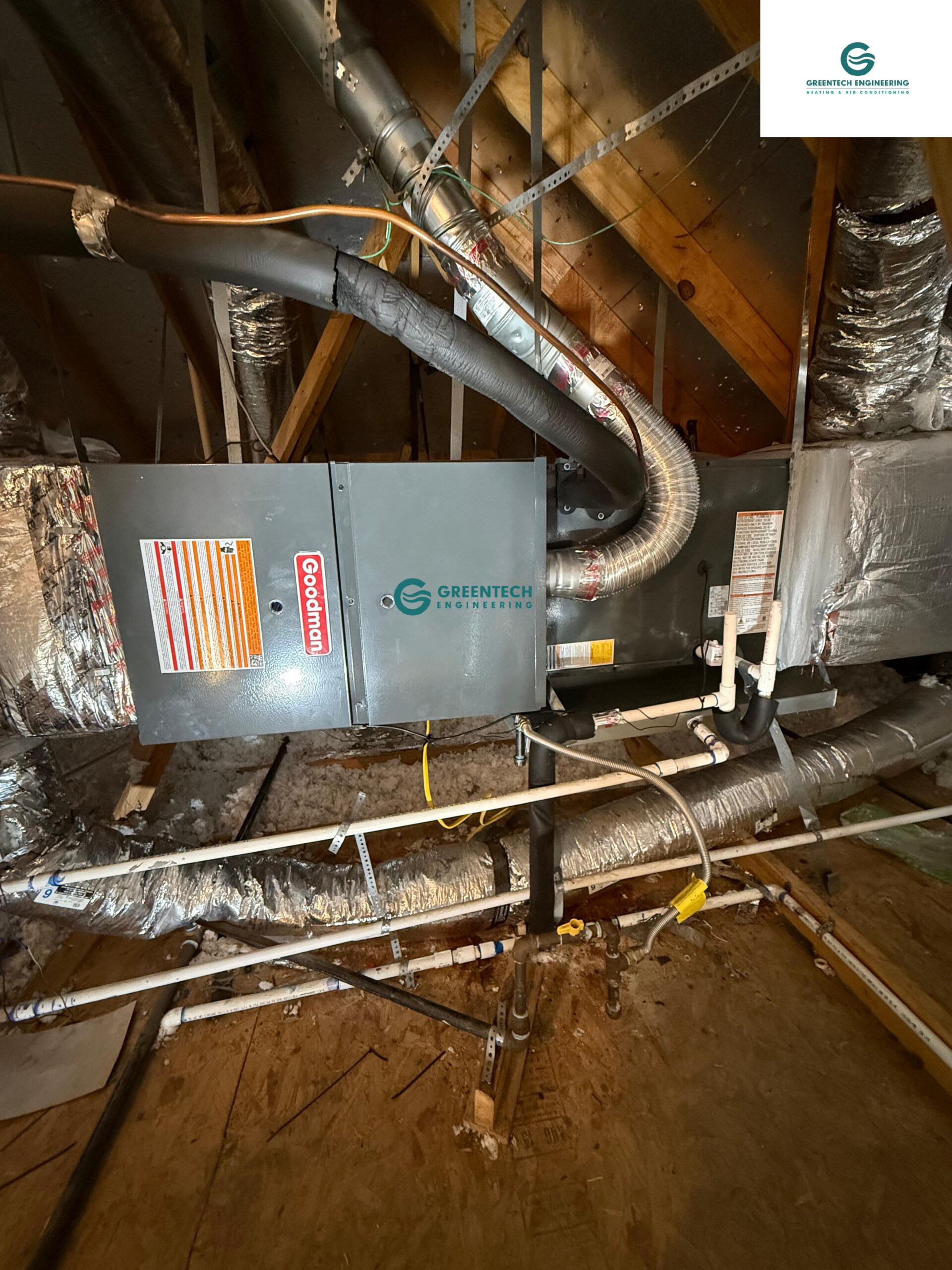 A newly installed Goodman 80,000 BTU horizontal gas furnace and sealed ductwork in a Little Elm attic