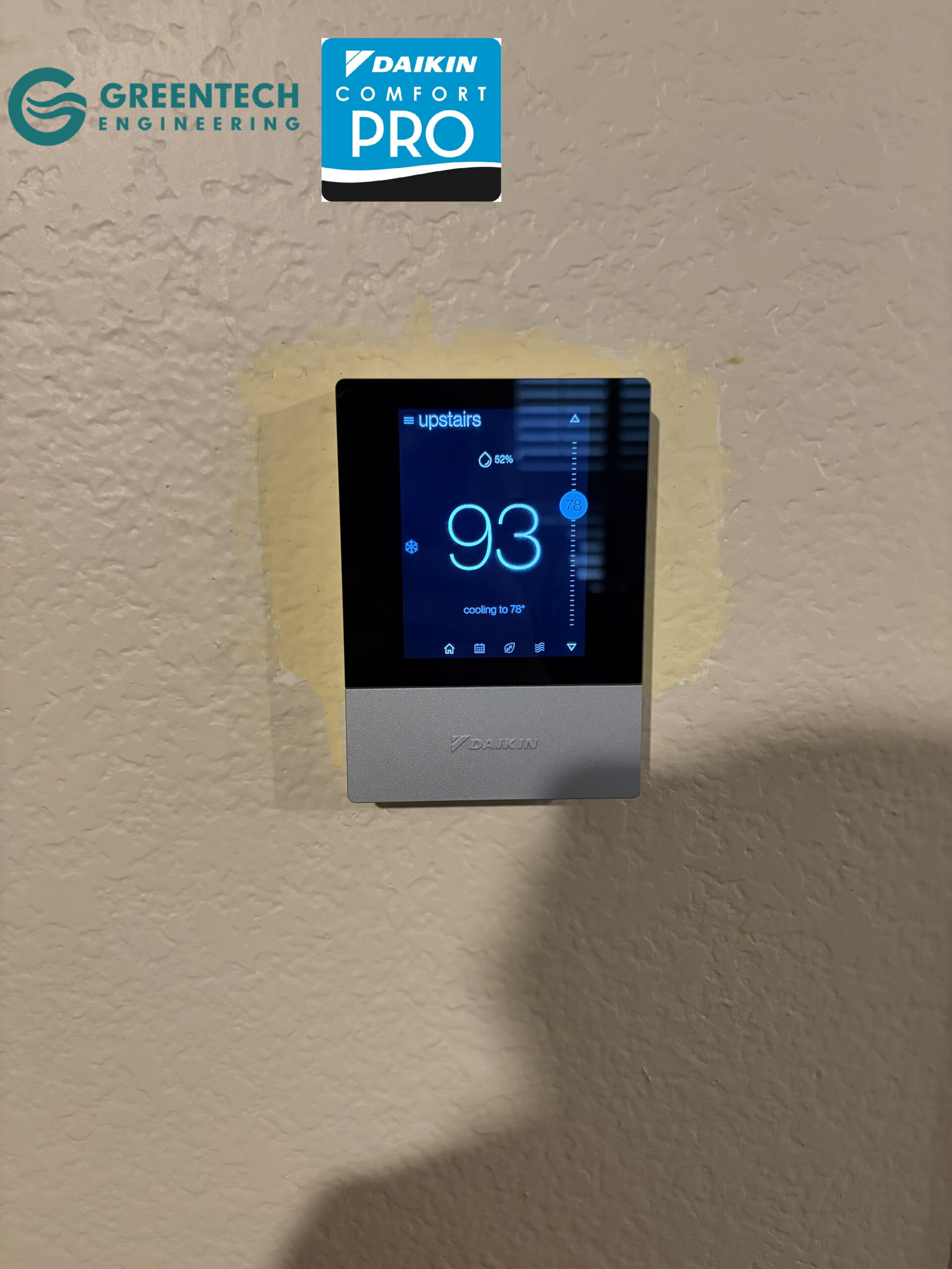 The Daikin One Touch Smart Communicating Thermostat installed on a wall in a Southlake home, displaying the indoor temperature and cooling status.