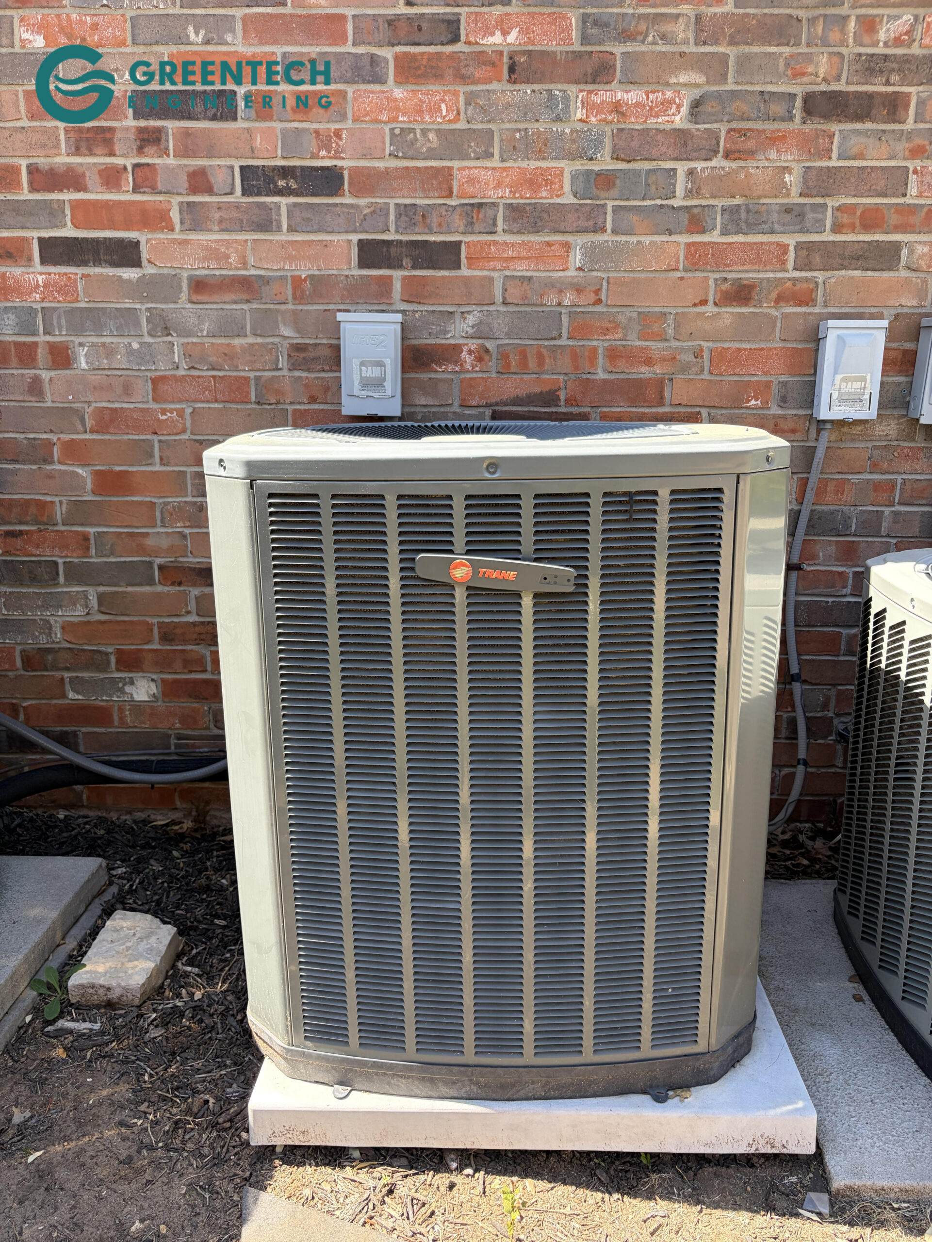The old, oversized 5-Ton Trane condenser and indoor attic air handler prior to being safely dismantled and recycled by Greentech Engineering.
