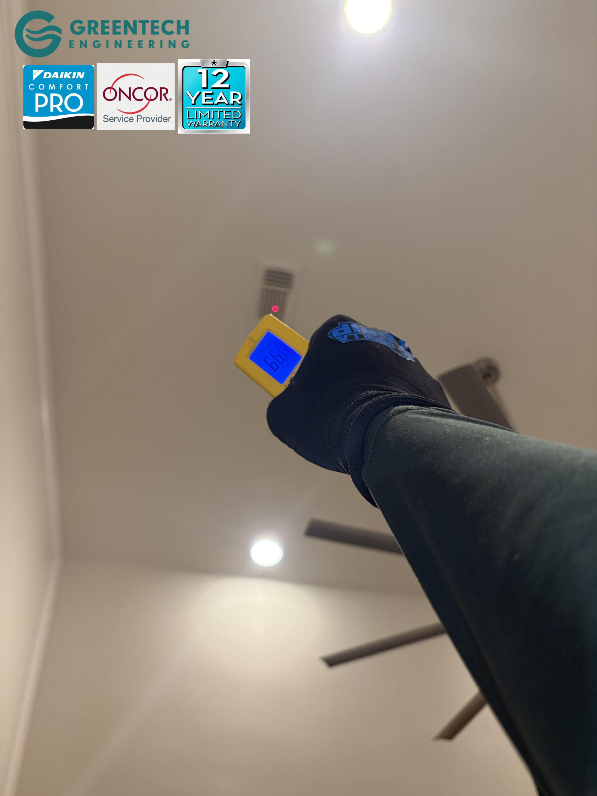 A digital infrared thermometer pointing at an upstairs ceiling vent in a Dallas home, registering a perfectly comfortable 66.0 degrees Fahrenheit.
