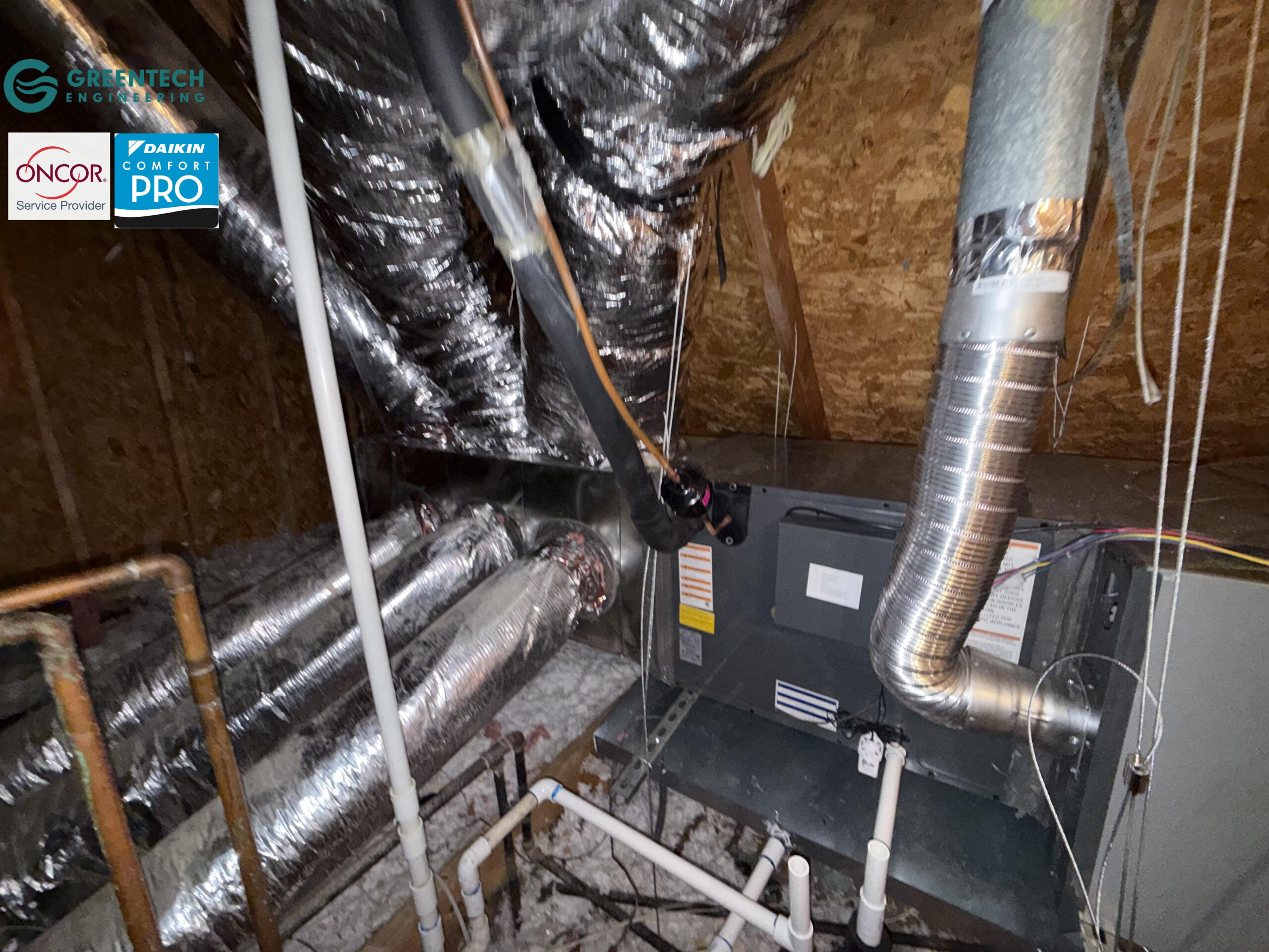 A newly modified HVAC ductwork system in a Dallas attic, featuring properly suspended R-8 flex ducts and a custom supply plenum sealed with mastic.