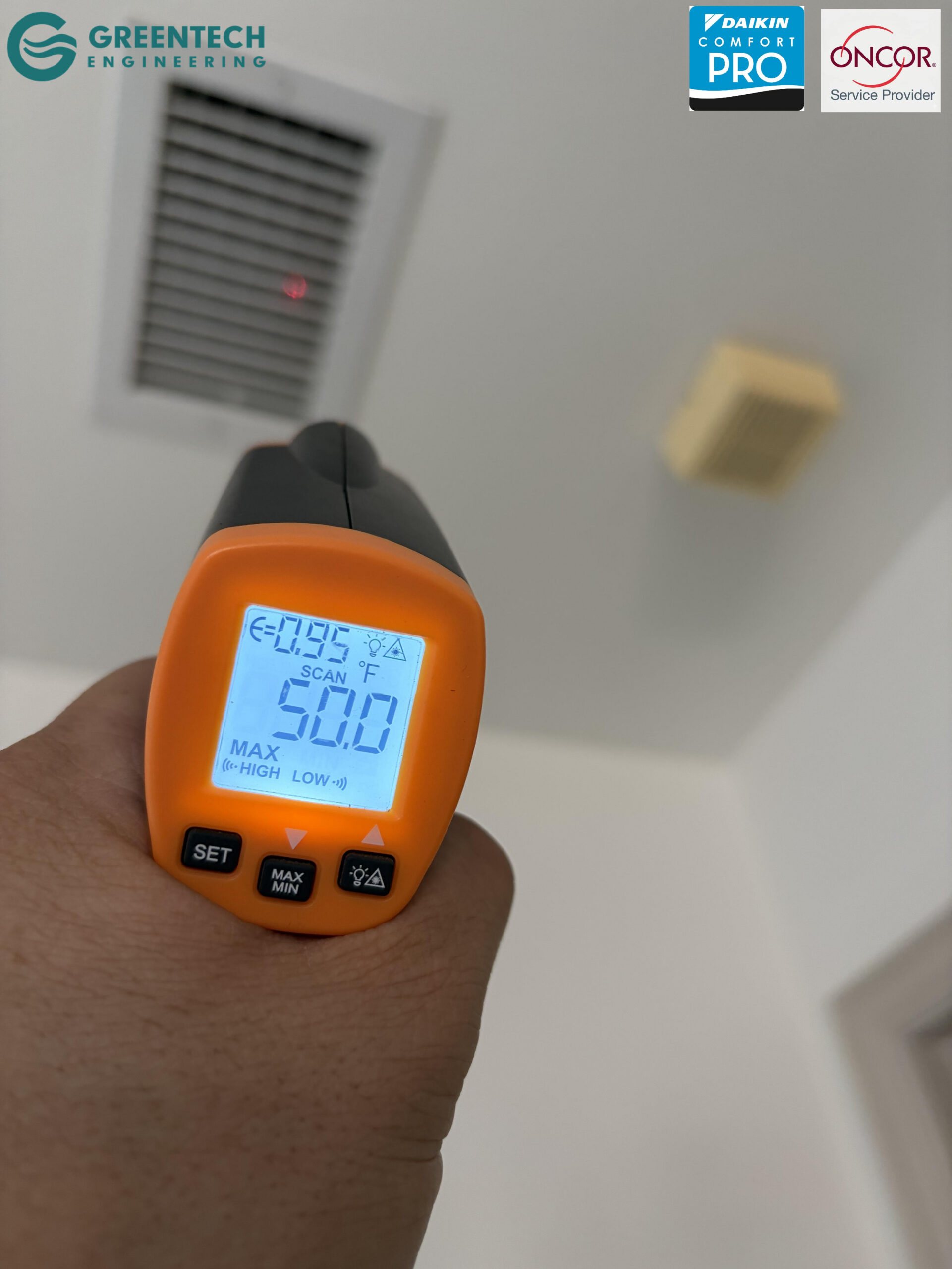 A digital temperature gun reading 50.0 degrees Fahrenheit blowing from a ceiling AC vent in Little Elm.