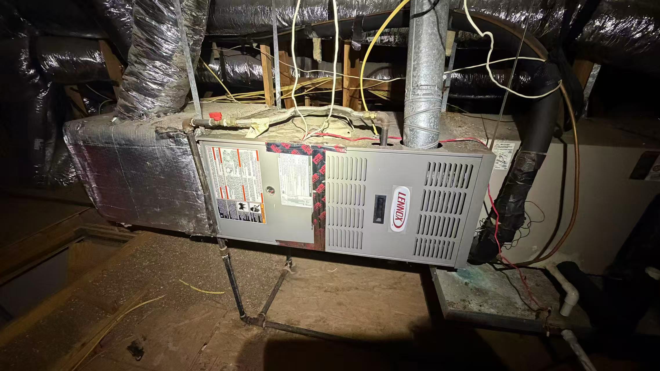 The previous attic-mounted indoor HVAC equipment before removal and replacement.