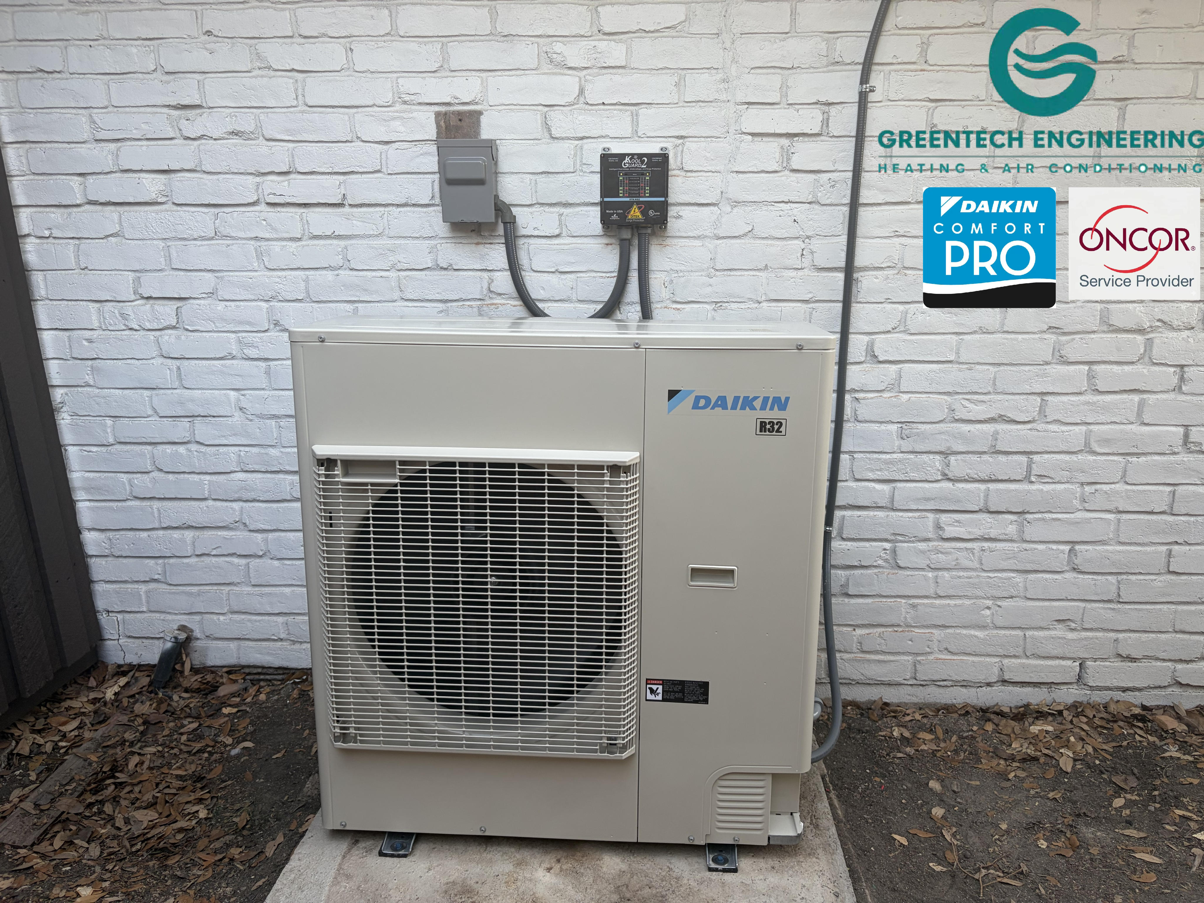 The completed Daikin FIT installation in Dallas 75248, including a dedicated Kool Guard voltage monitor and surge-protection device for the inverter-driven system.