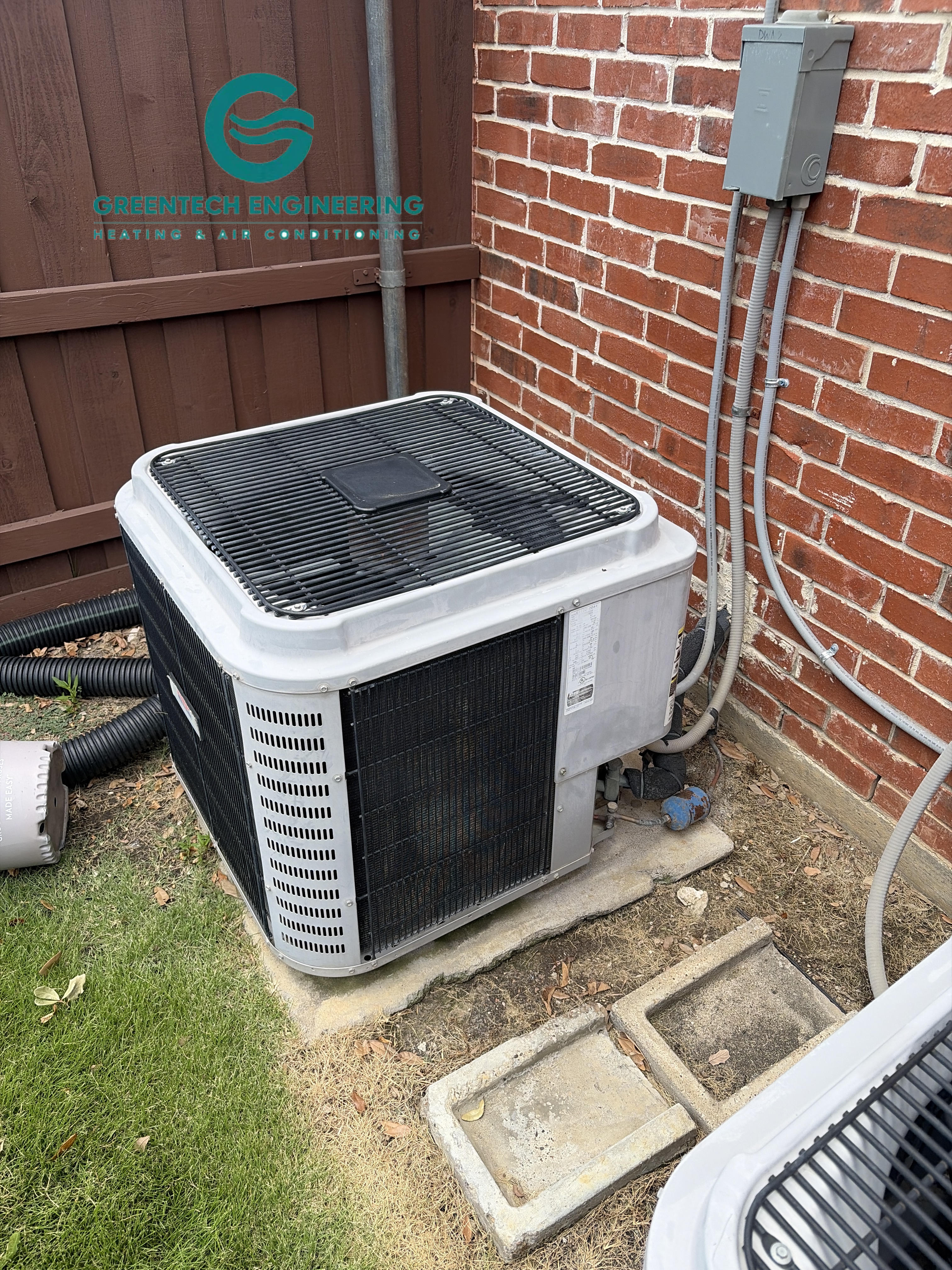 Existing nominal 5-ton outdoor air conditioner before replacement at a Coppell home