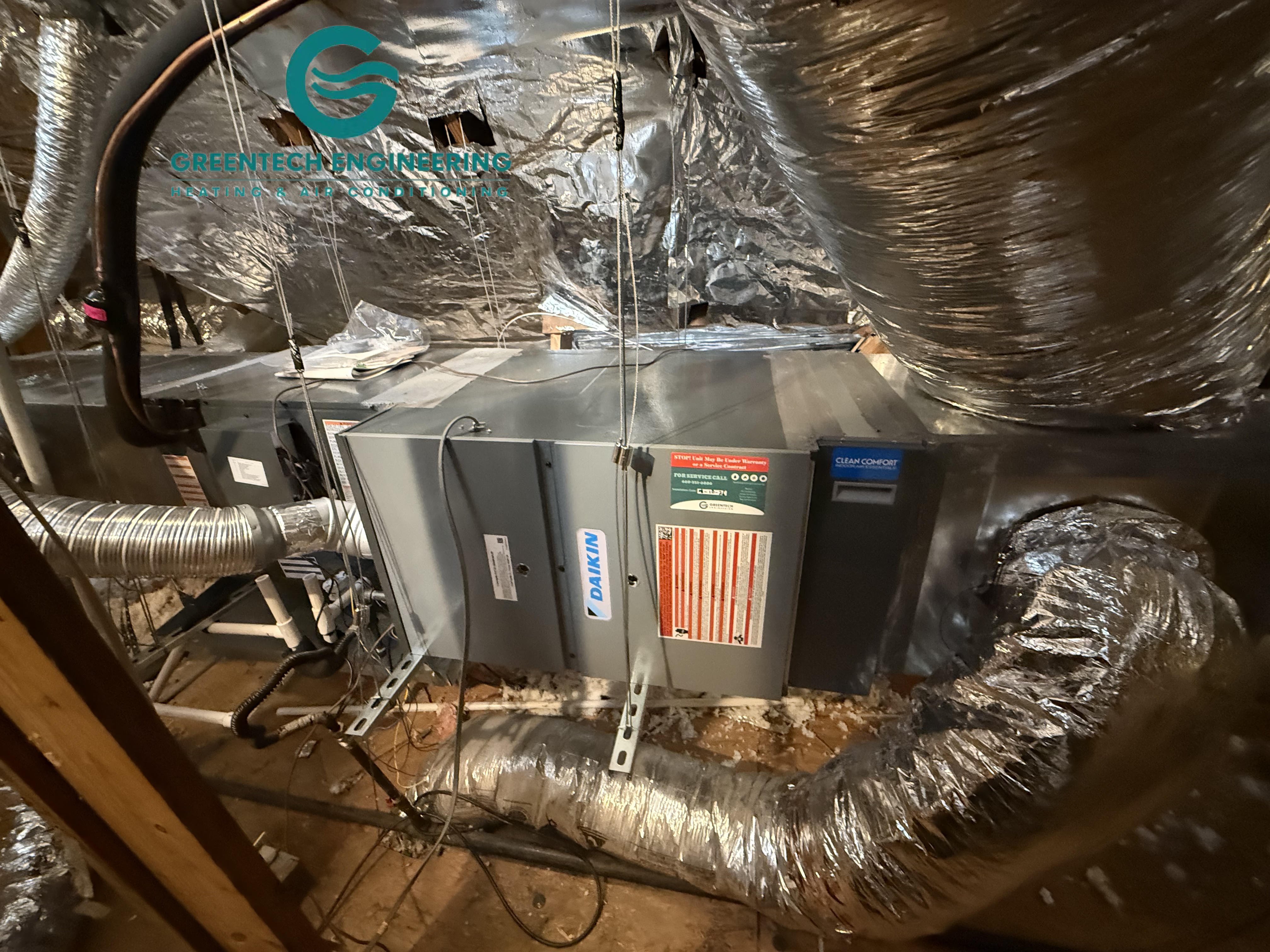 Daikin coil, gas furnace and media air cleaner connected to ductwork in a Coppell attic
