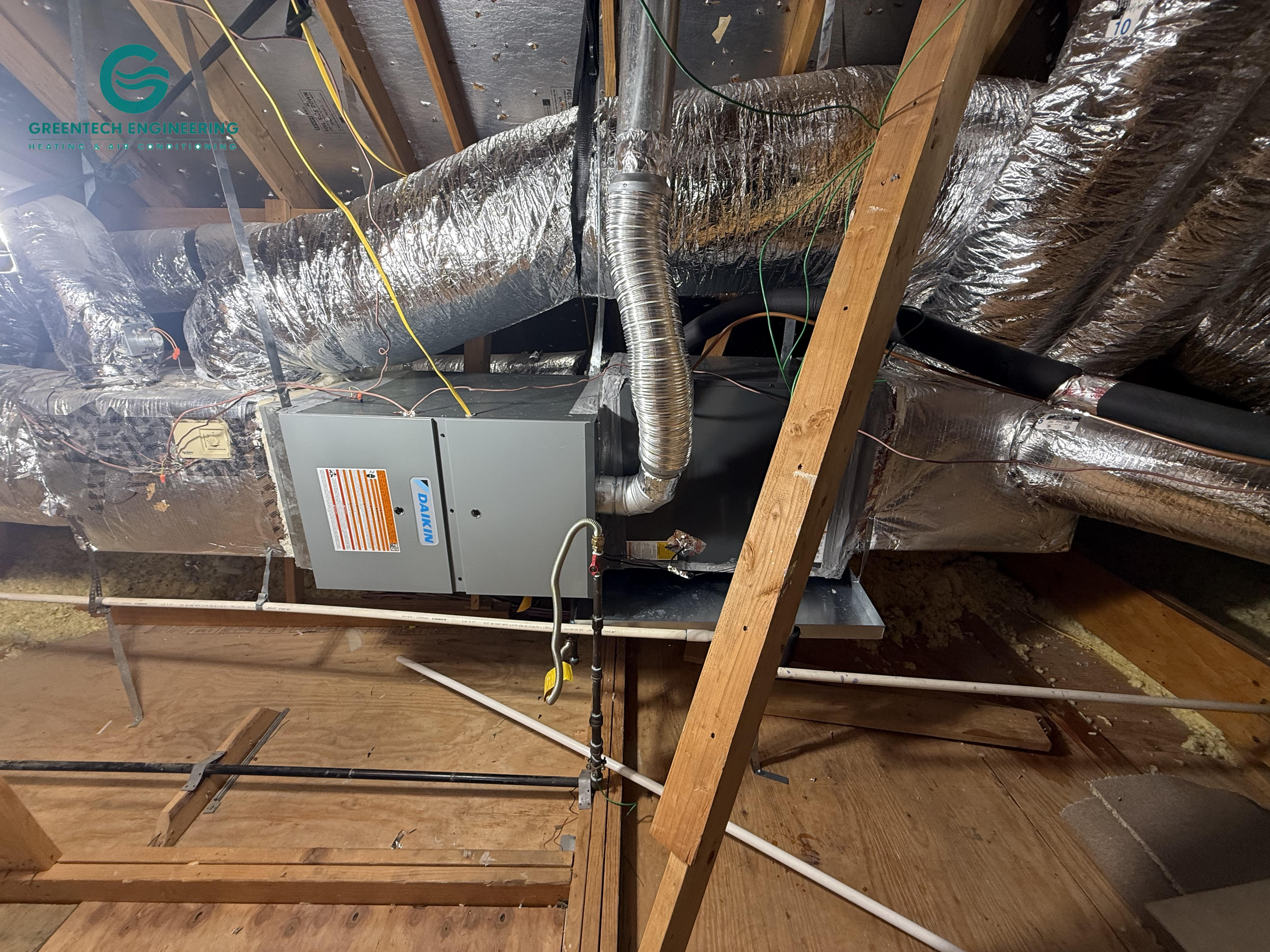 New horizontal Daikin gas furnace and evaporator coil installed in a Frisco attic