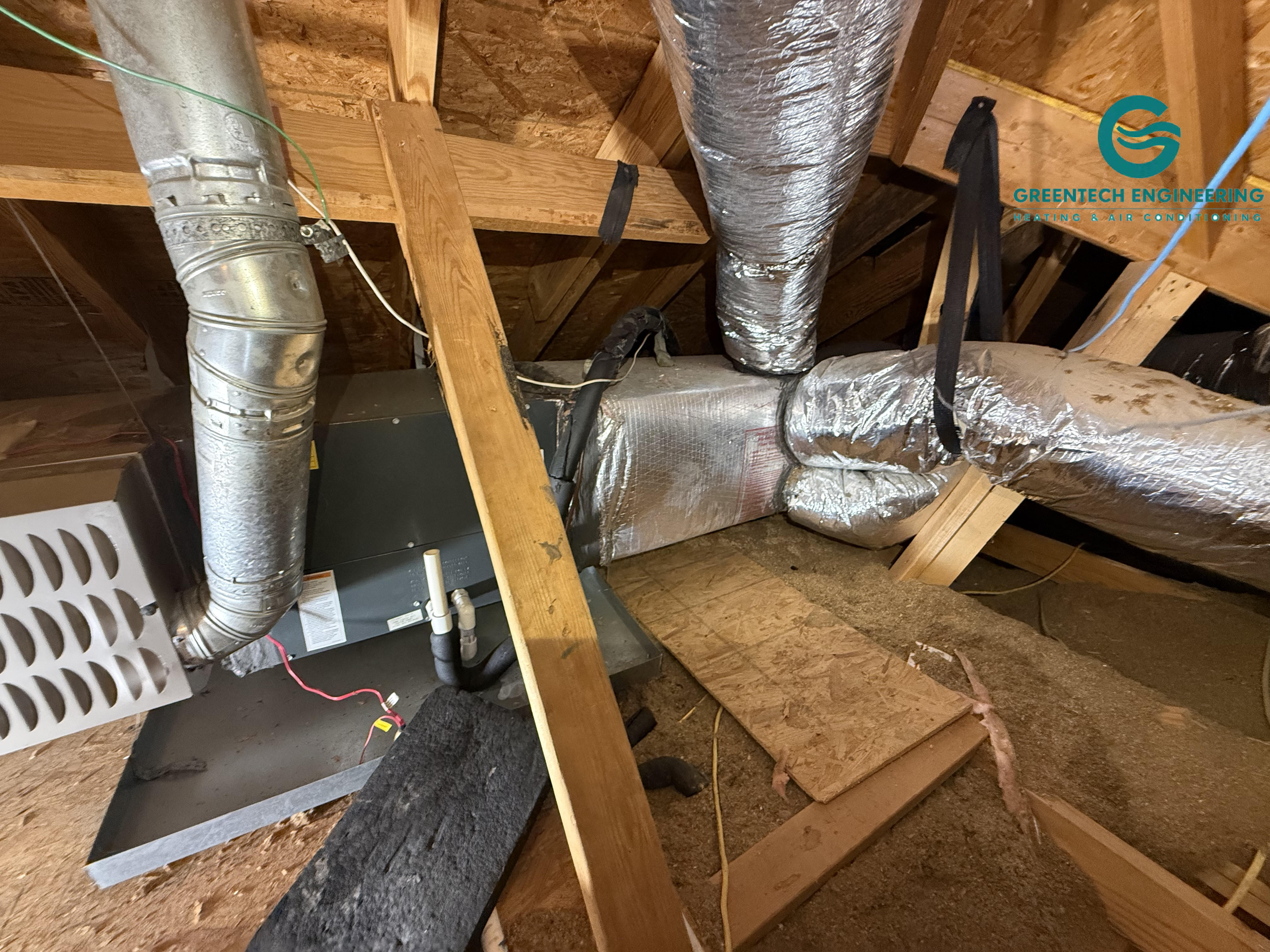 Existing horizontal upstairs furnace and evaporator coil in an attic before replacement