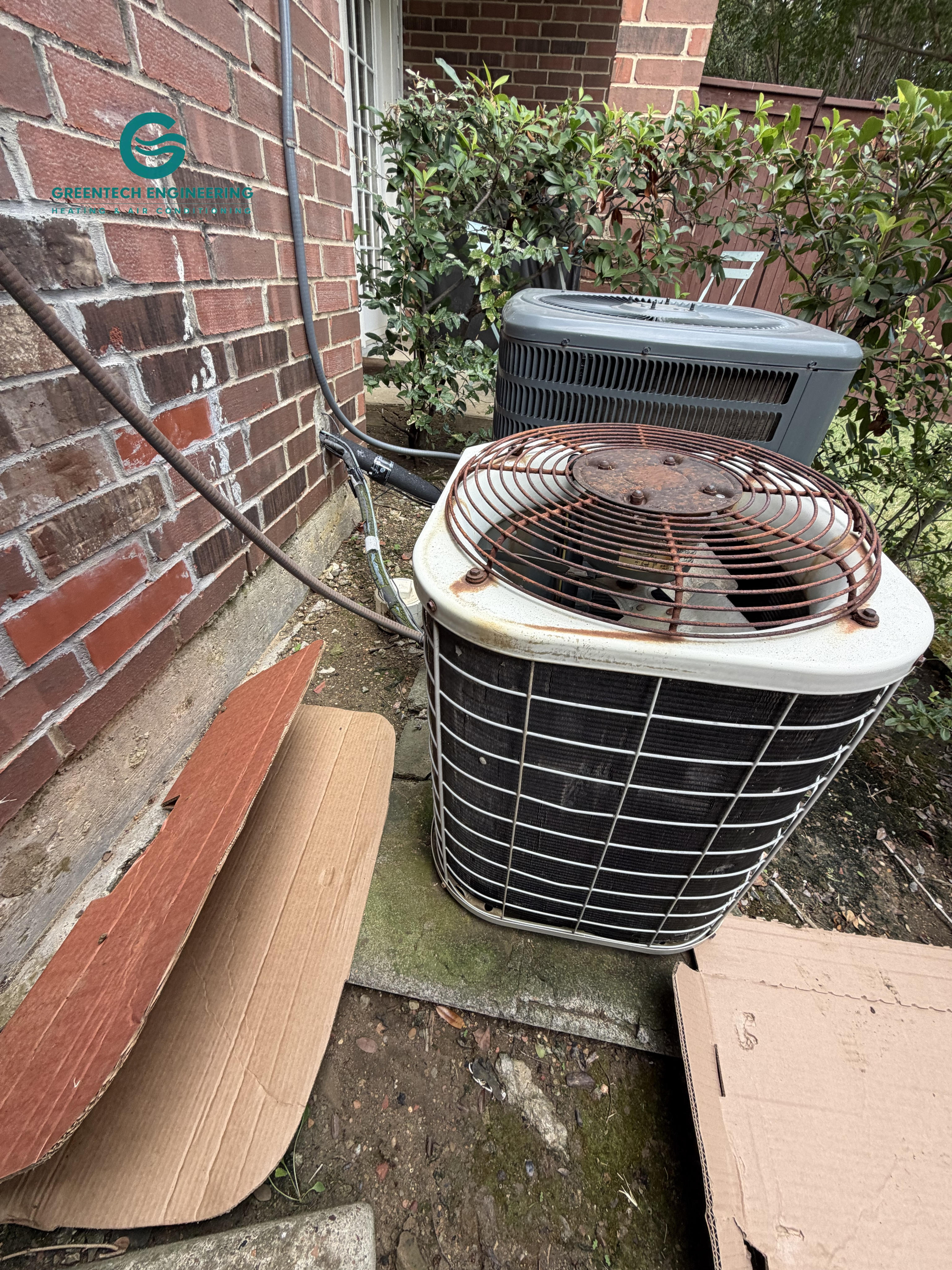 Older R-22 straight-cooling condenser before replacement in Irving