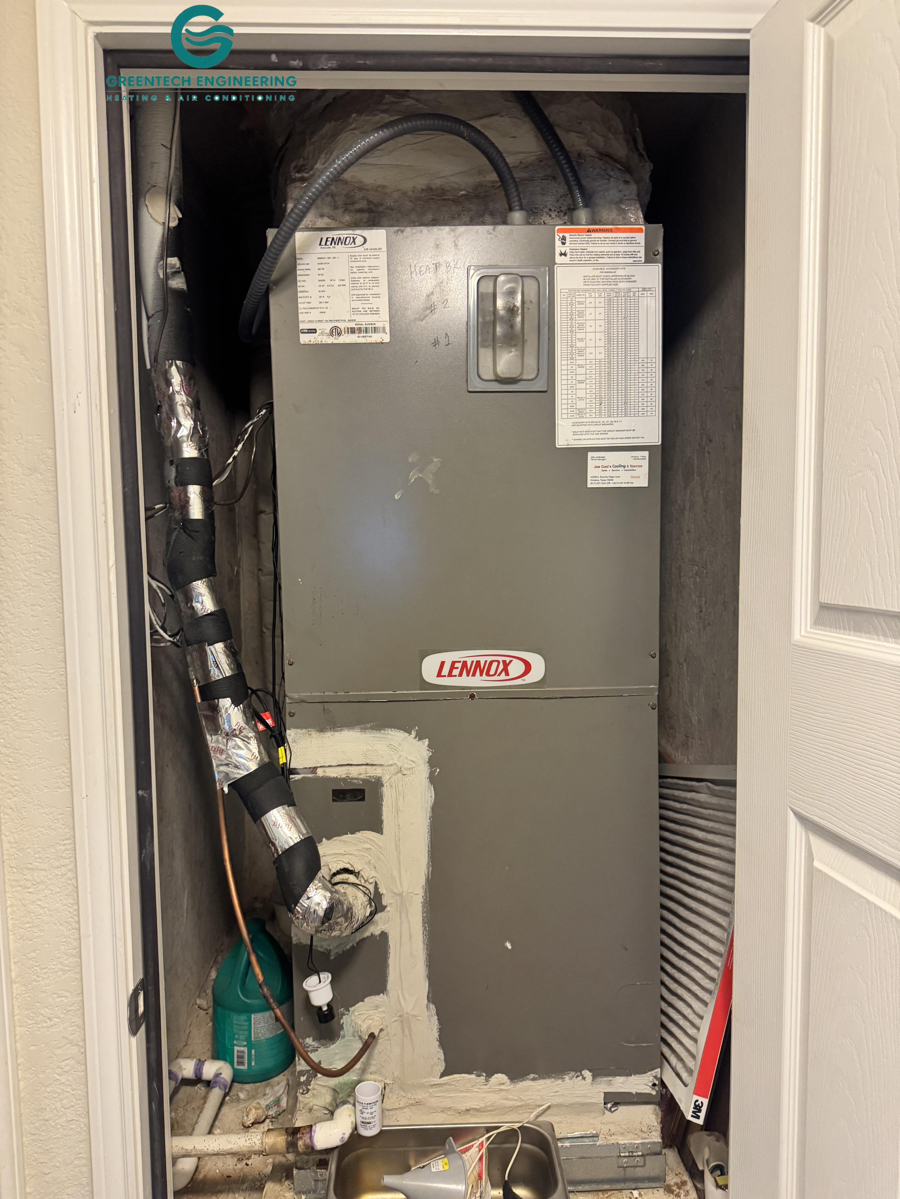 Existing Lennox upflow air handler in a Fort Worth mechanical closet