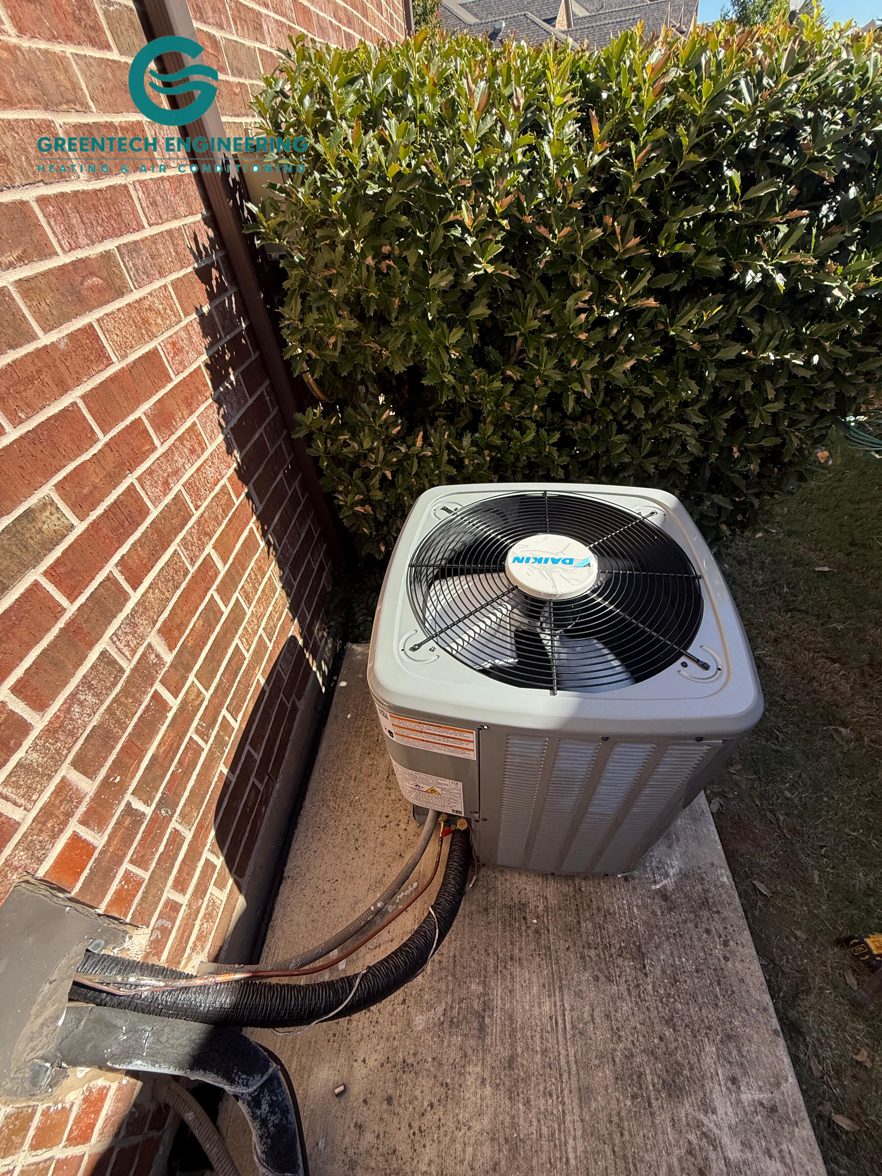 Completed Daikin R-32 condenser installation beside a Keller Texas home.