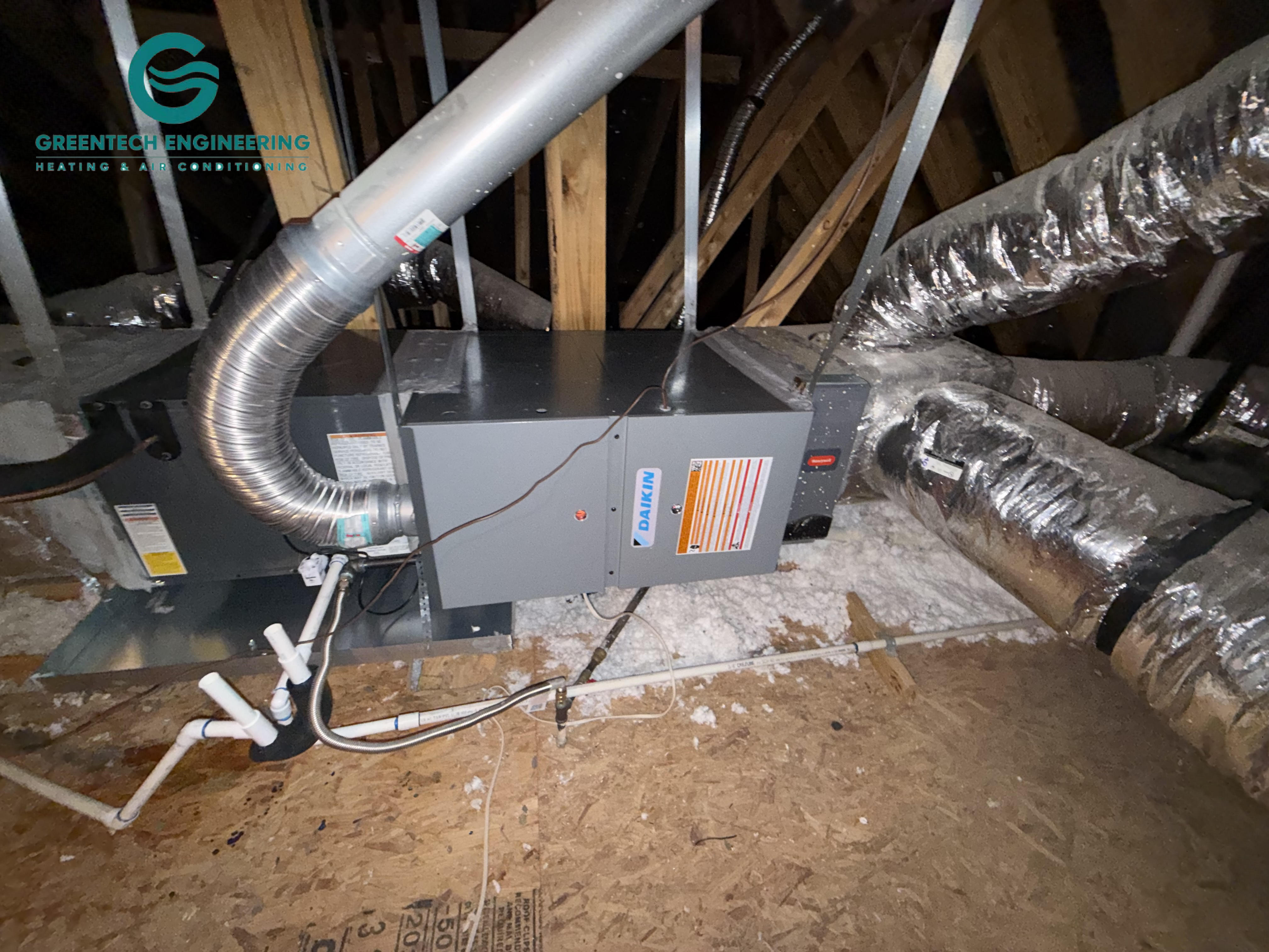 Newly installed horizontal Daikin gas furnace and evaporator coil in a Keller attic.