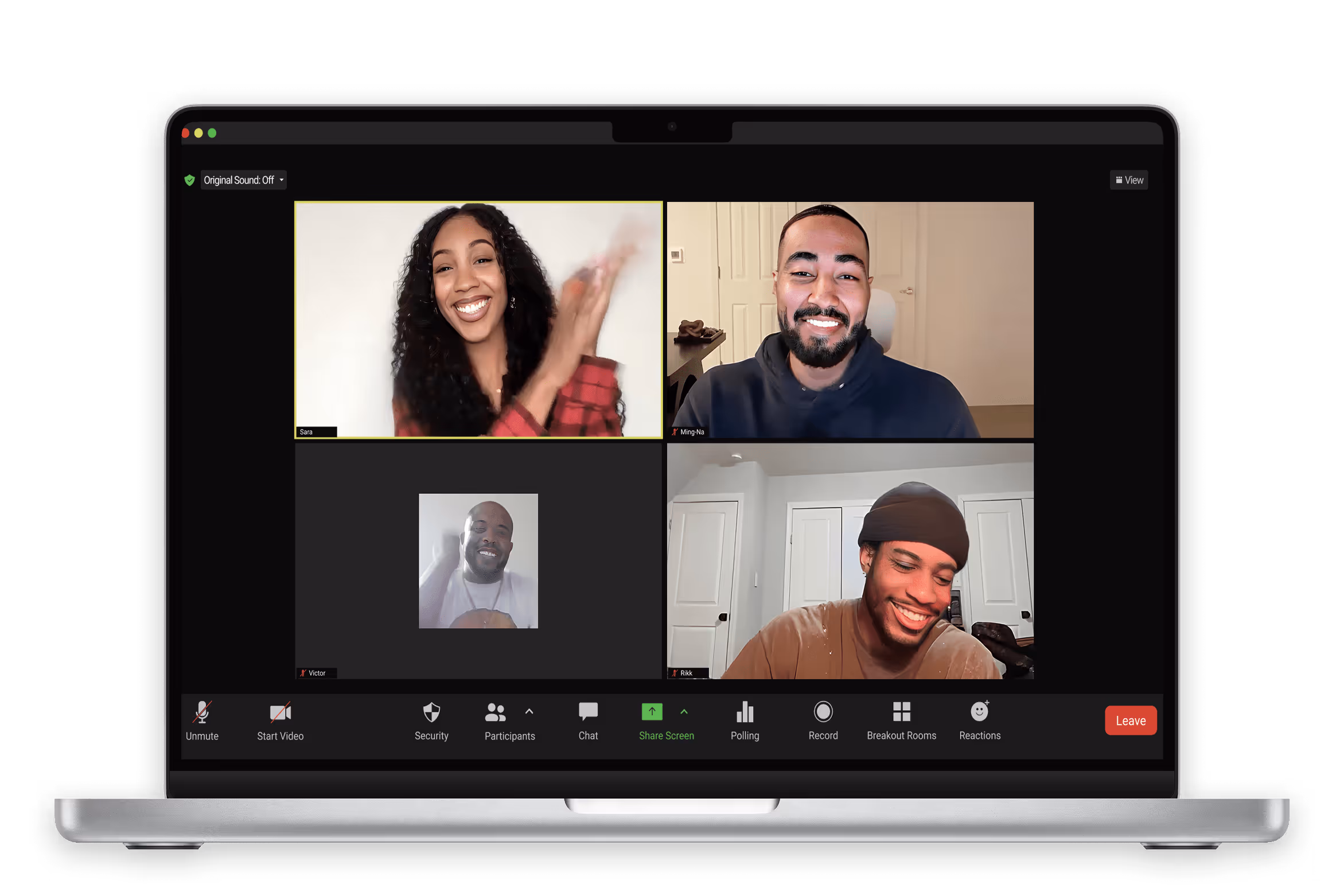 MacBook Pro laptop displaying a four-person zoom video conference call with smiling participants. 