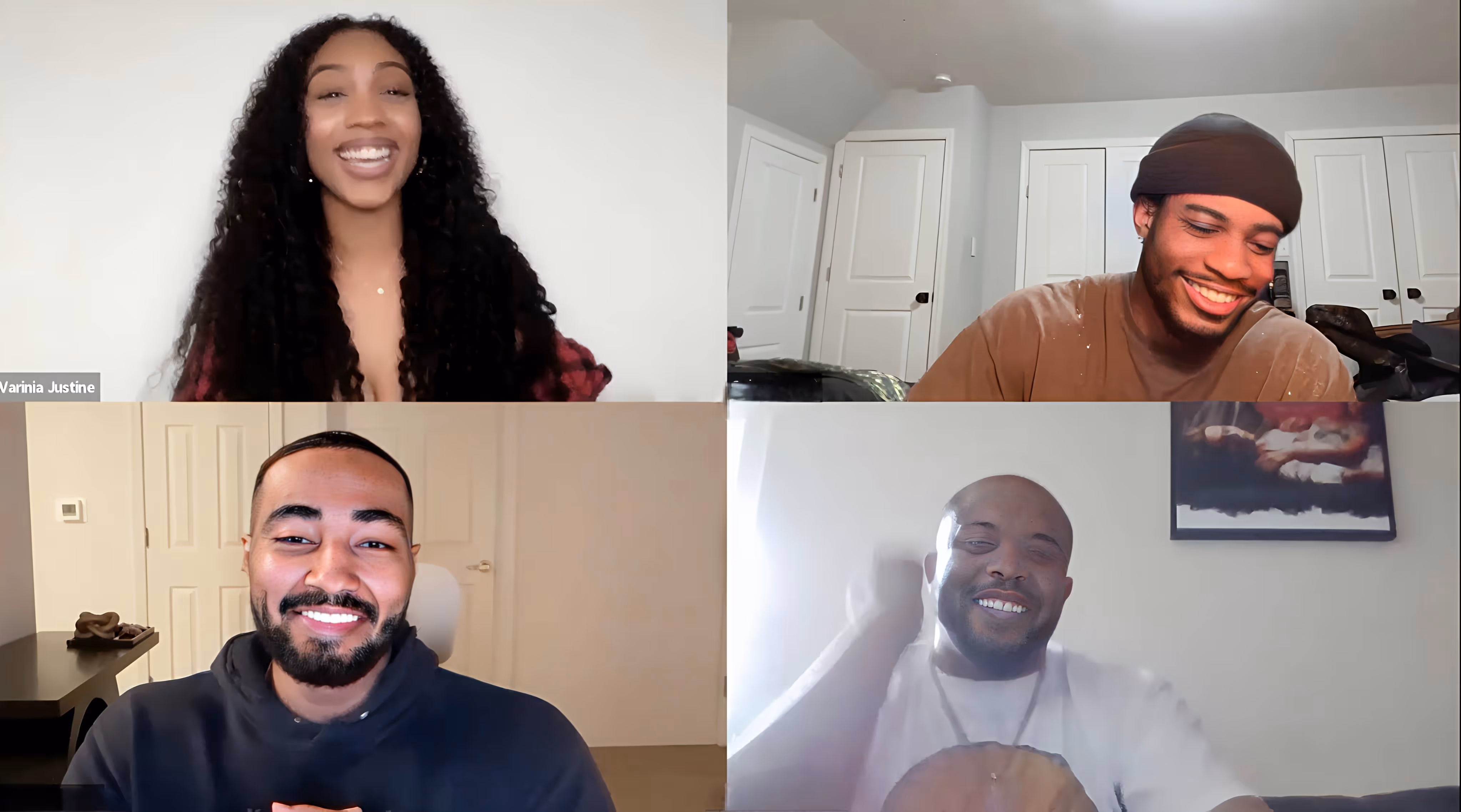 Four smiling individuals engaged in a virtual online class. 