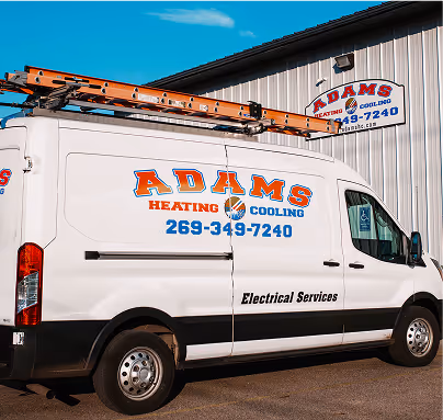 Adams Heating and Cooling service van displaying contact information and electrical services.