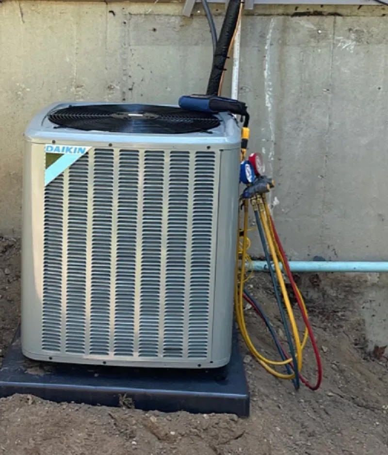 Technician reviewing a checklist for HVAC preventative maintenance tasks
