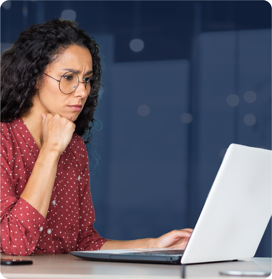 Frustrated professional looking at a laptop