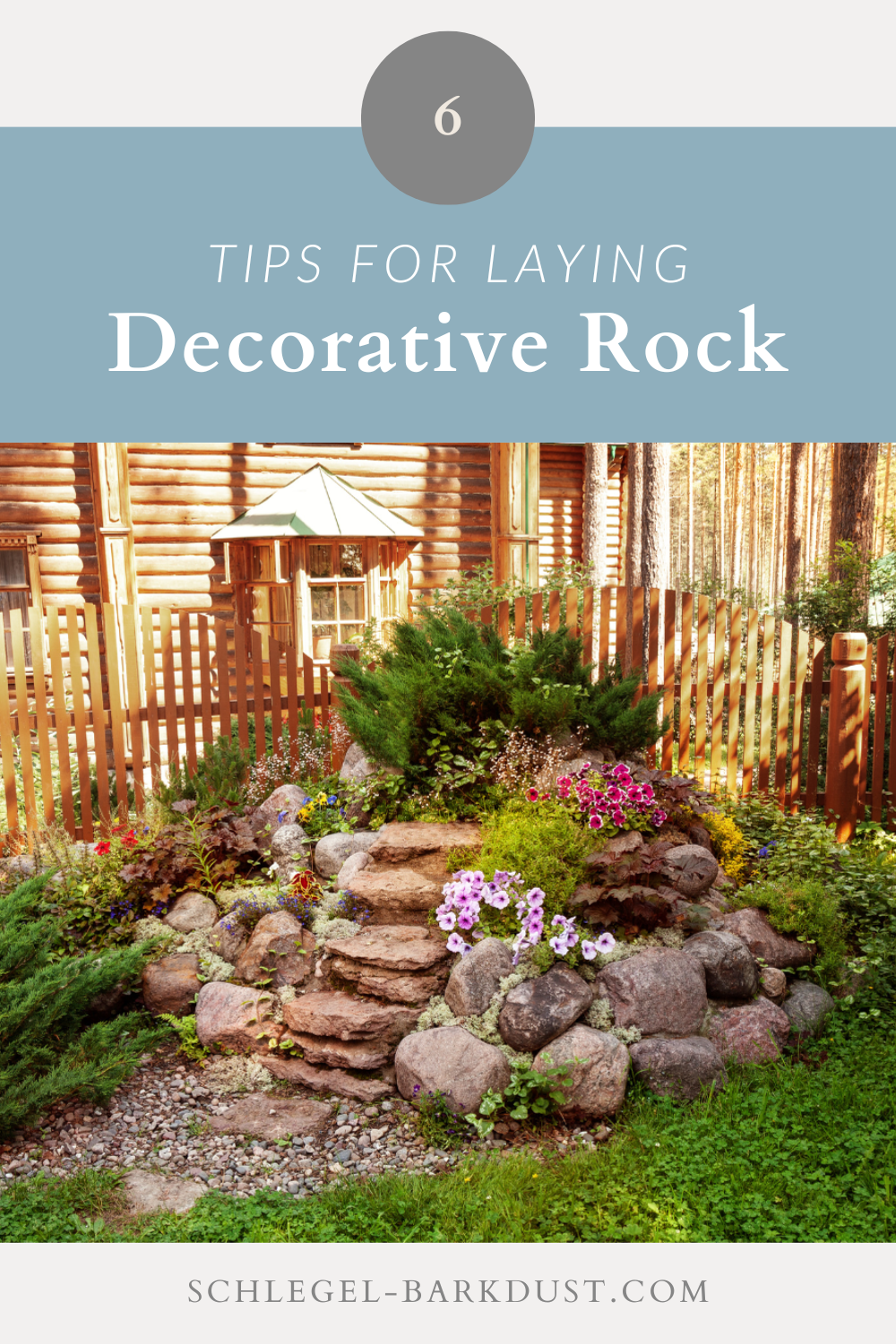 A decorative rock feature in a garden. A text overlay that reads "6 Tips For Laying Decorative Rock"