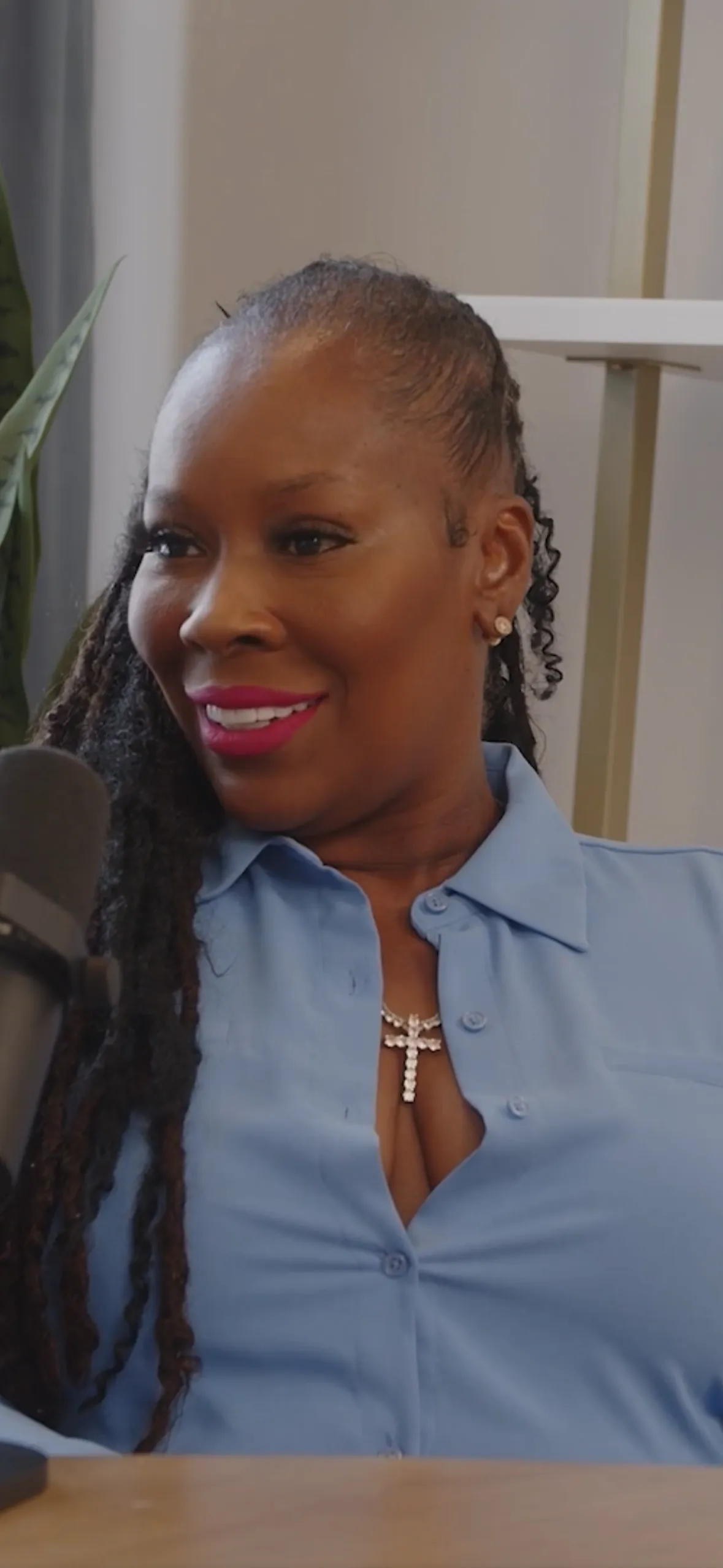 Dr. Topeka K Sam Speaking into Microphone