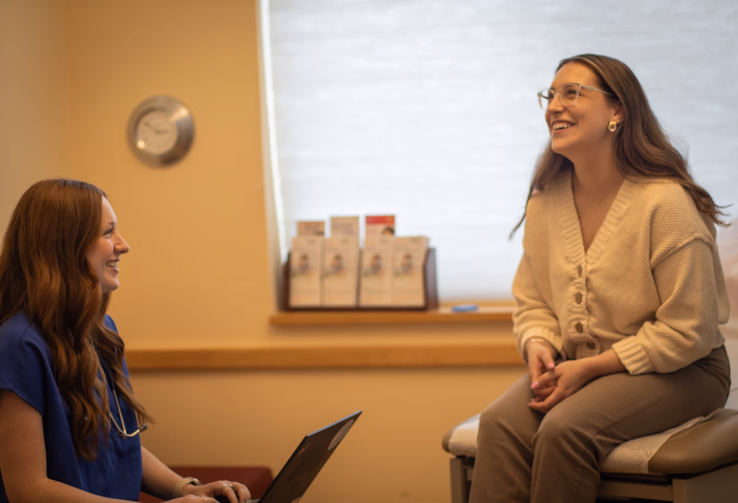 Smiling healthcare professional and patient in a medical consultation room