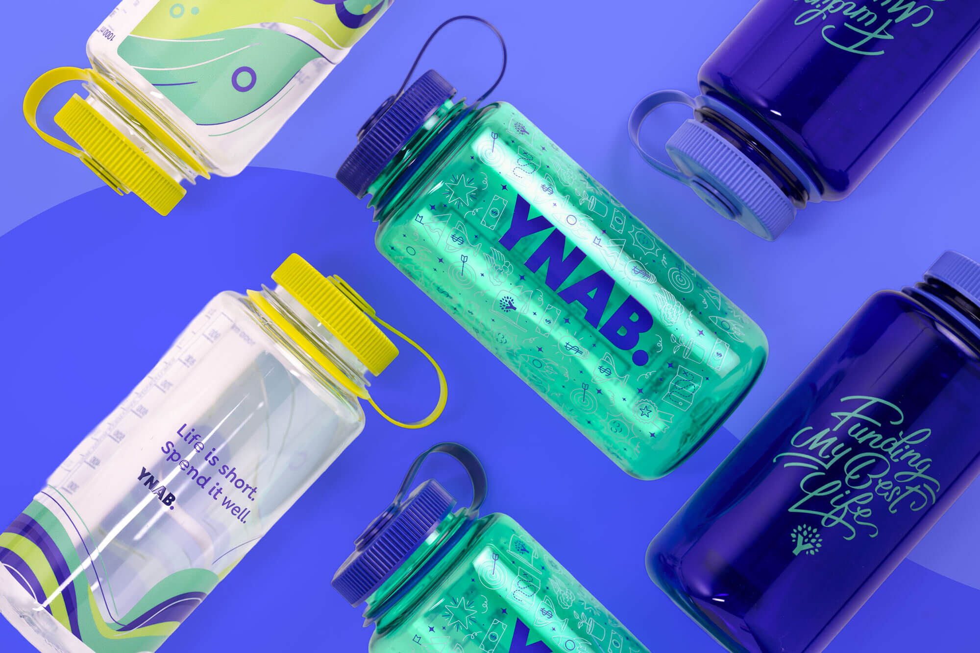 Group of colorful YNAB water bottles, featuring the teal YNAB bottle with doodle design and blue logo.