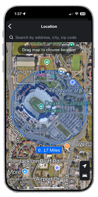 Image of a mobile phone with a satellite view of an area. There is a blue circle overlay showing a geofence and the distance of the geofence of 0.17 miles in diameter.