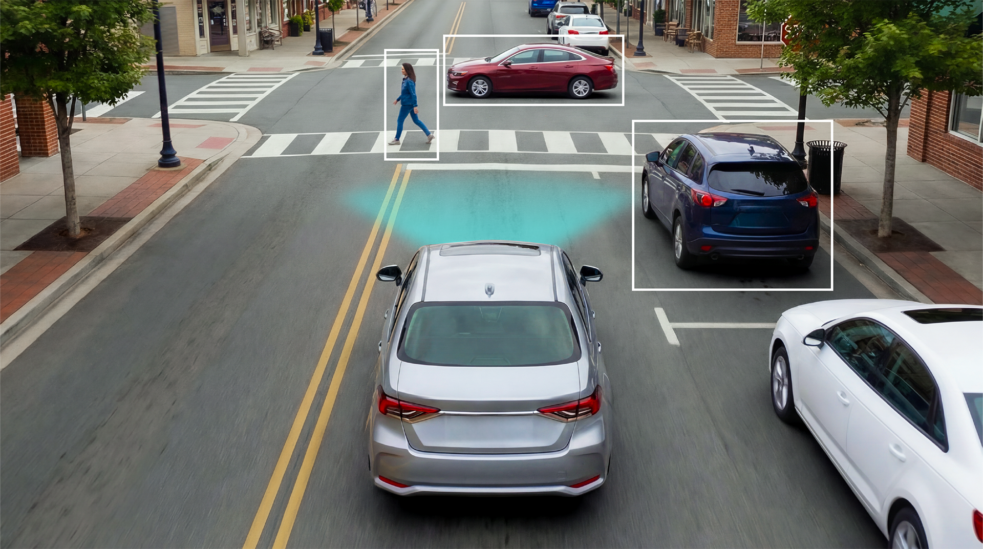 ADAS advanced driver assistance systems detecting vehicles and pedestrians at an urban intersection to prevent collisions and improve driver awareness