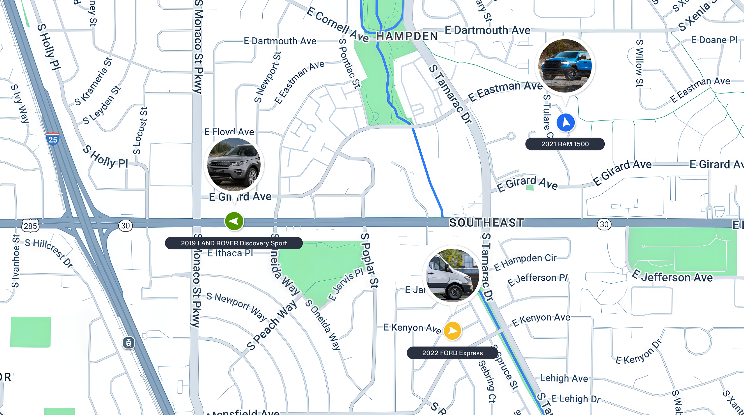 GPS monitoring system map showing three tracked vehicles, a pickup, an SUV, and a van, across a city.