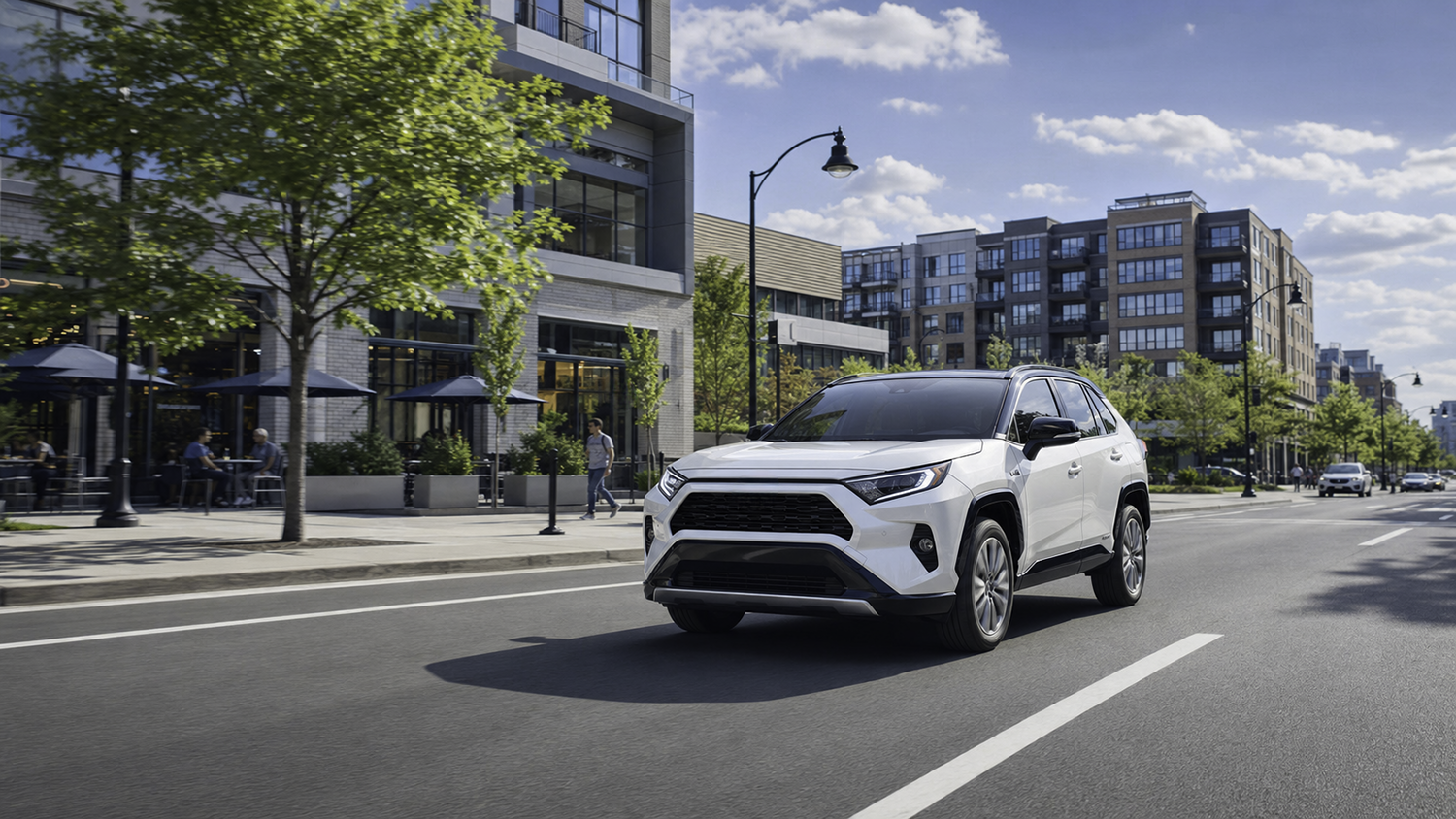 White compact SUV on a sunny city street, the kind of everyday family driving a real-time GPS tracker follows live.