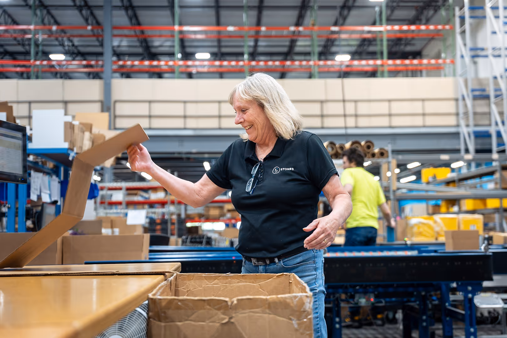 Warehouse worker packing boxes