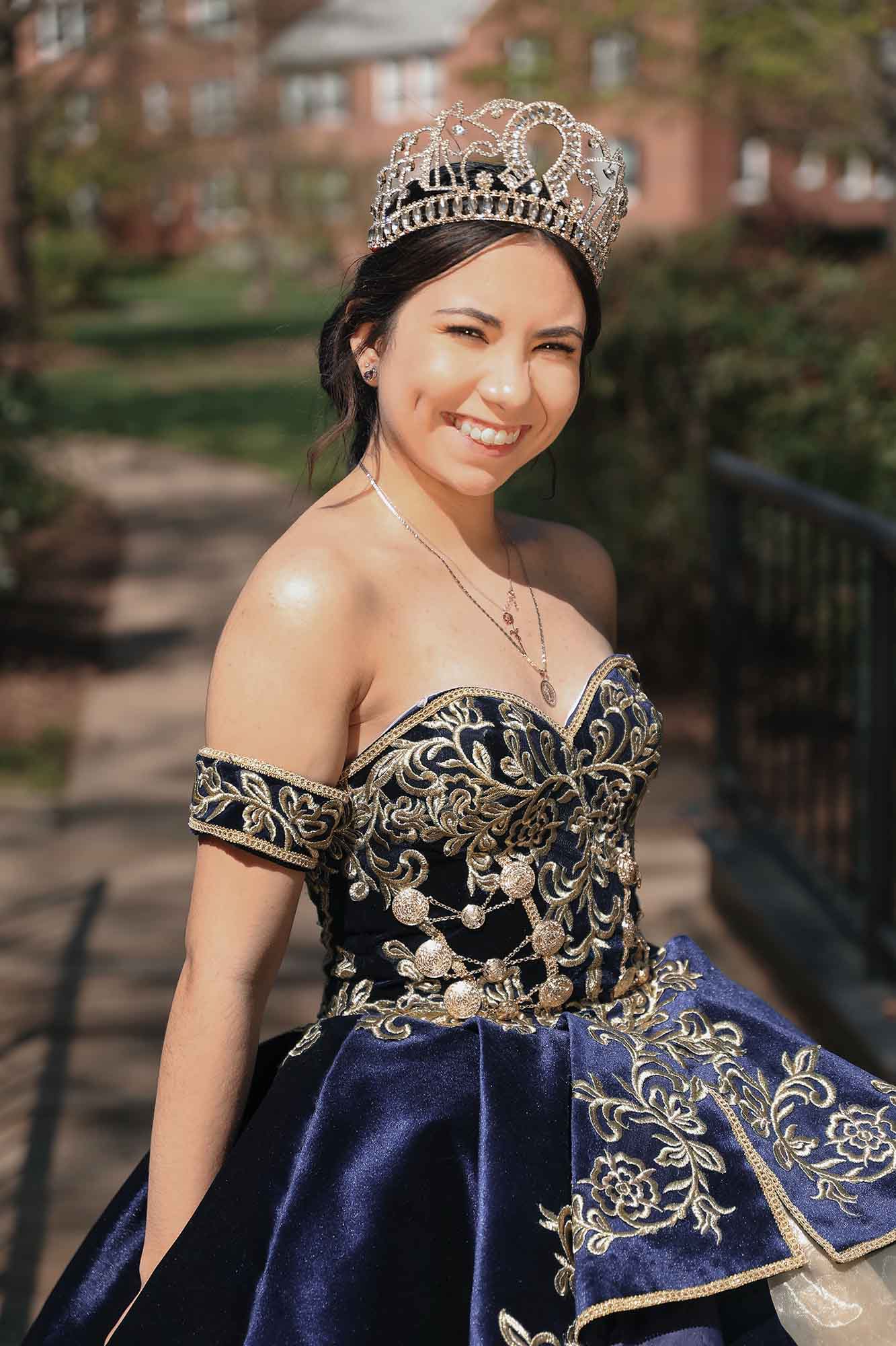 quinceañera portrait young woman in navy blue ball gown with embroidery outdoor session Alexandria VA