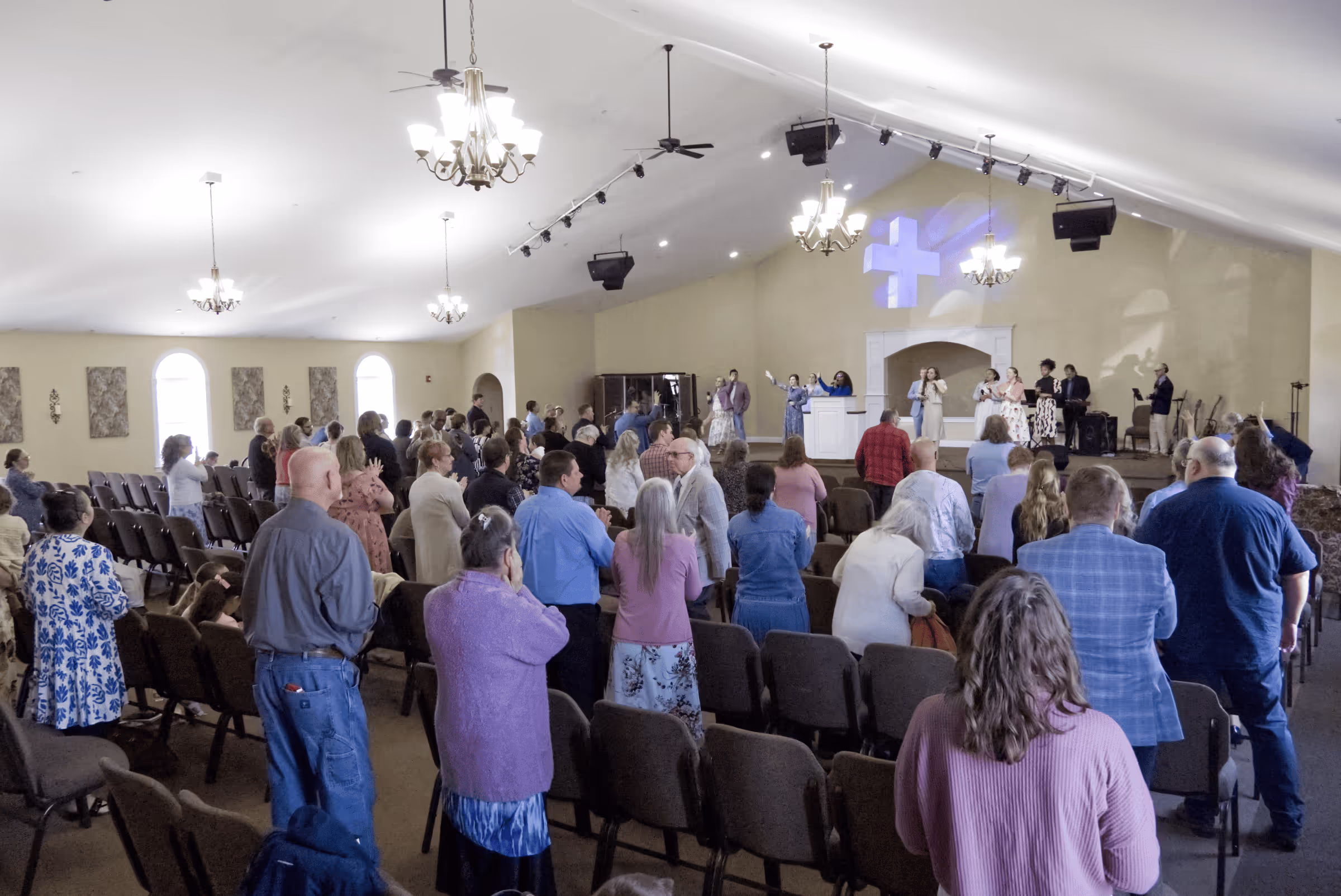 people worshiping together in sanctuary at crossroads church