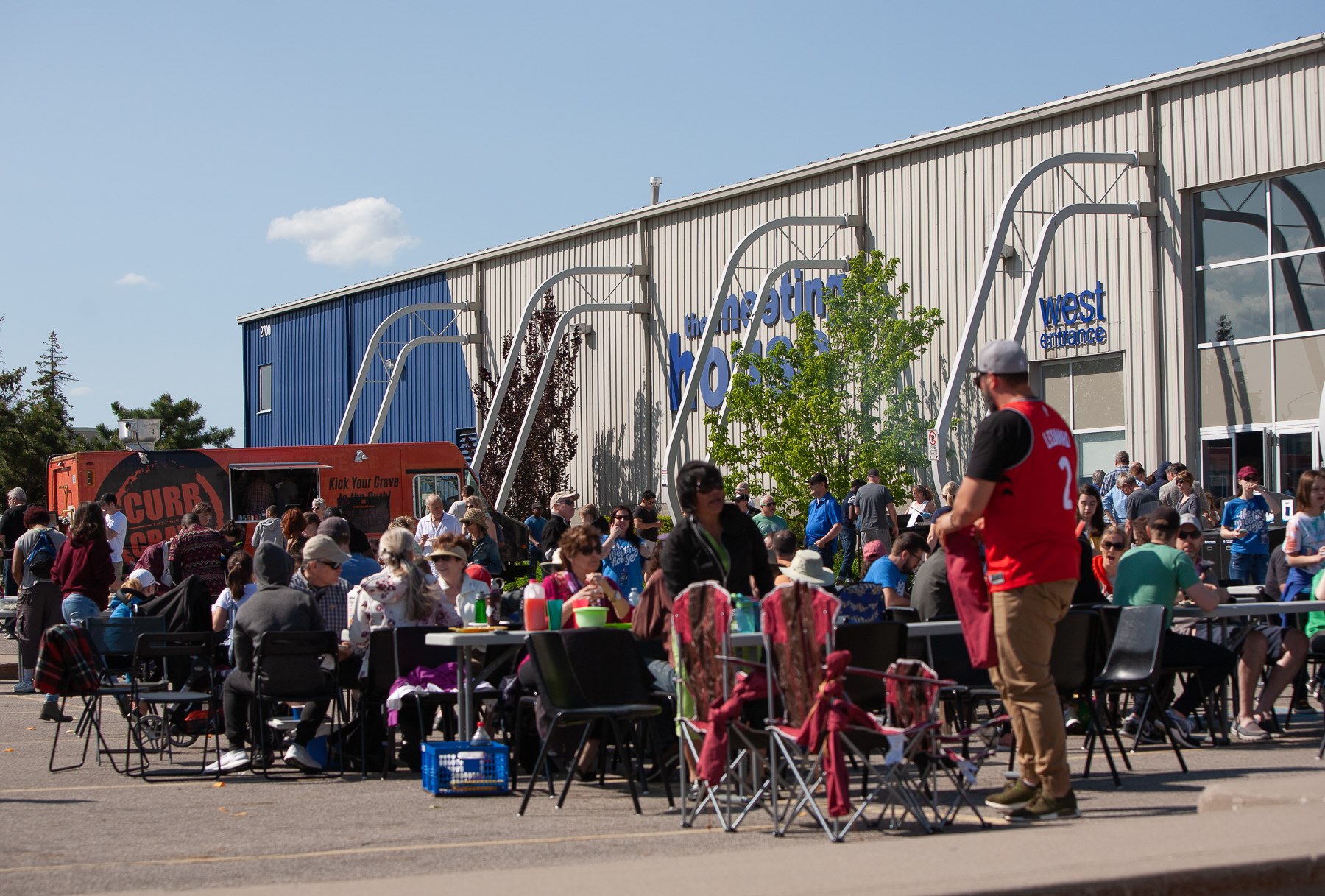 Families participating in outdoor community games and activities in Oakville