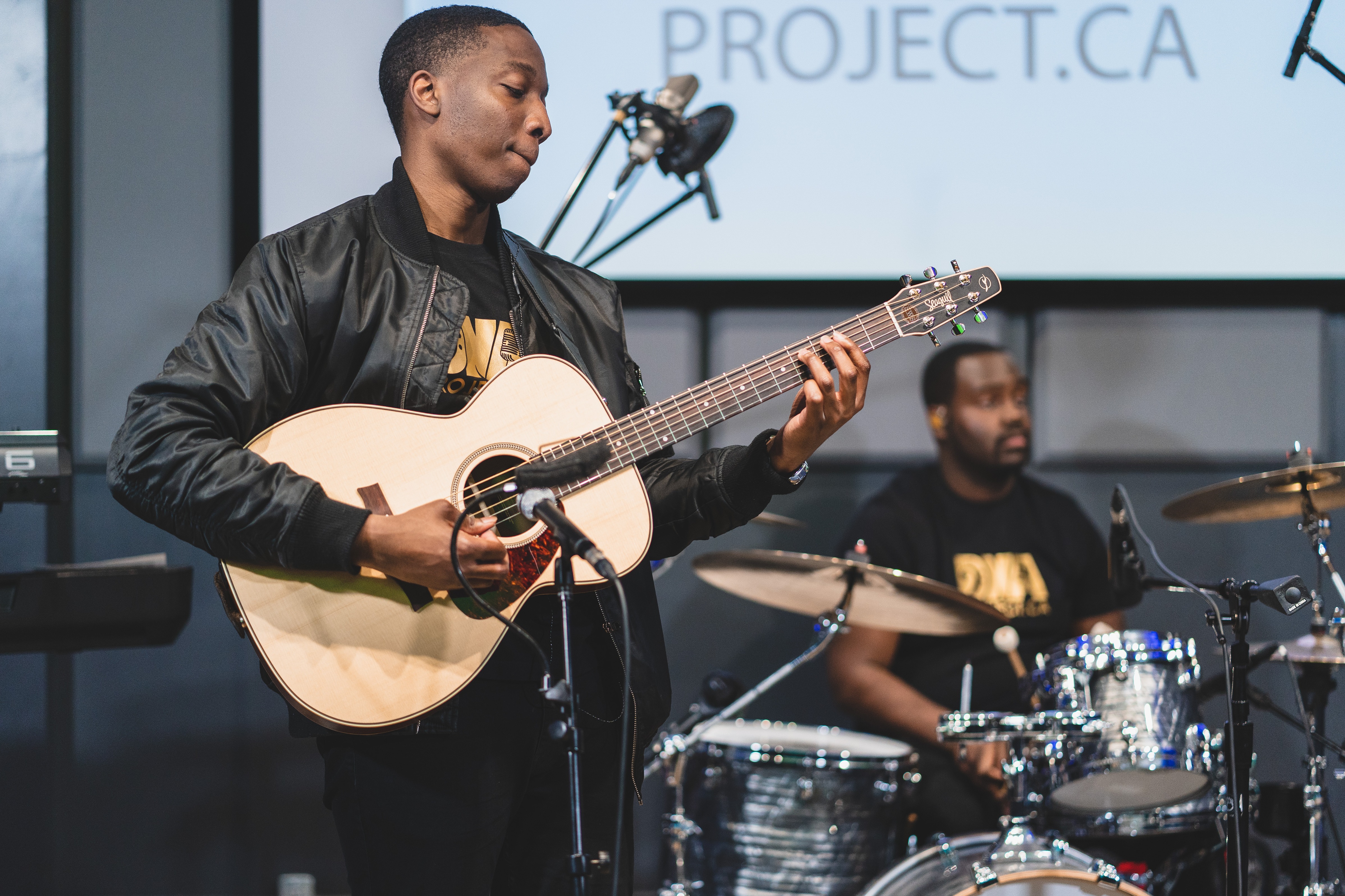 Vocalist performing at DNA Project talent showcase in Toronto recording studio