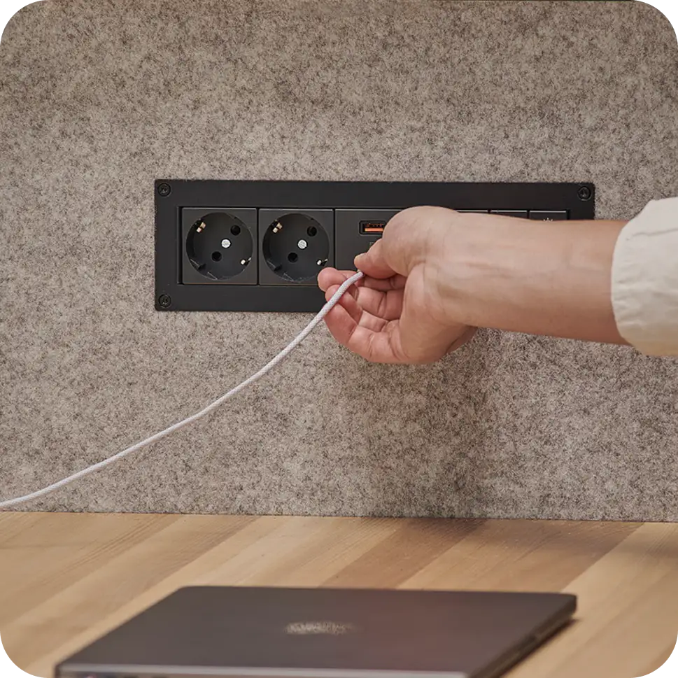Power outlets with dual USB-C ports inside Persy Booth for device charging