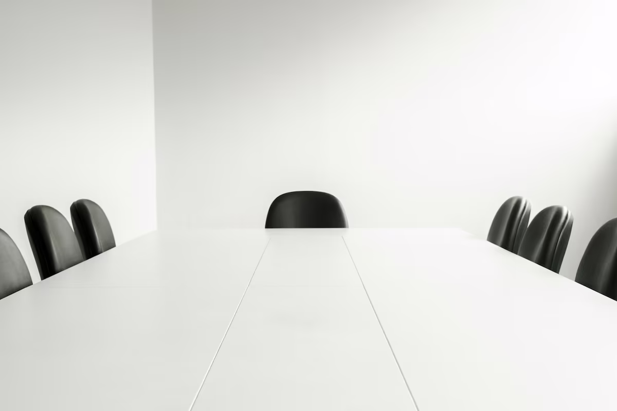 Bright minimal meeting room illustrating shared collaboration space in modern offices