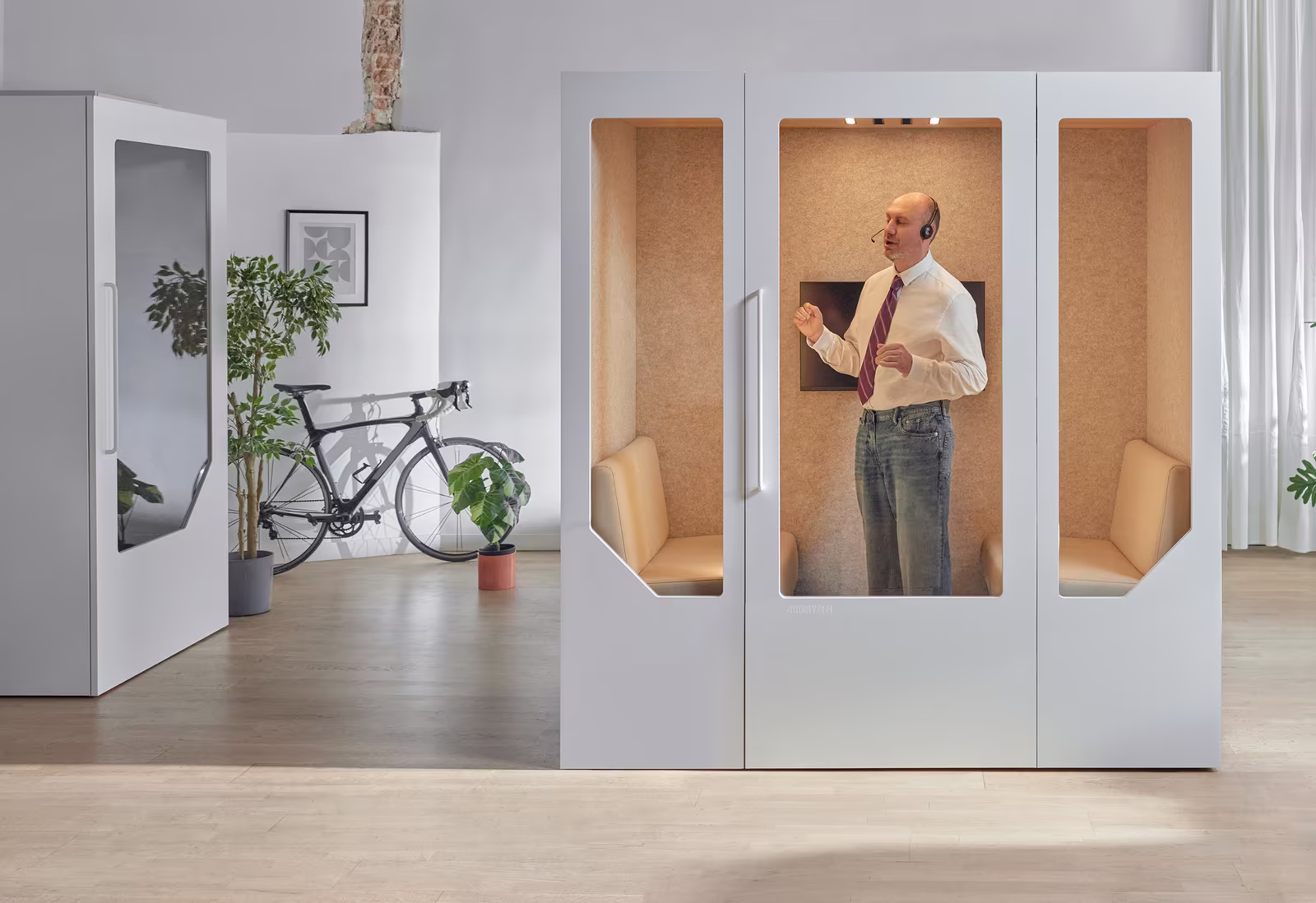 Soundproof office phone booths in a modern workspace