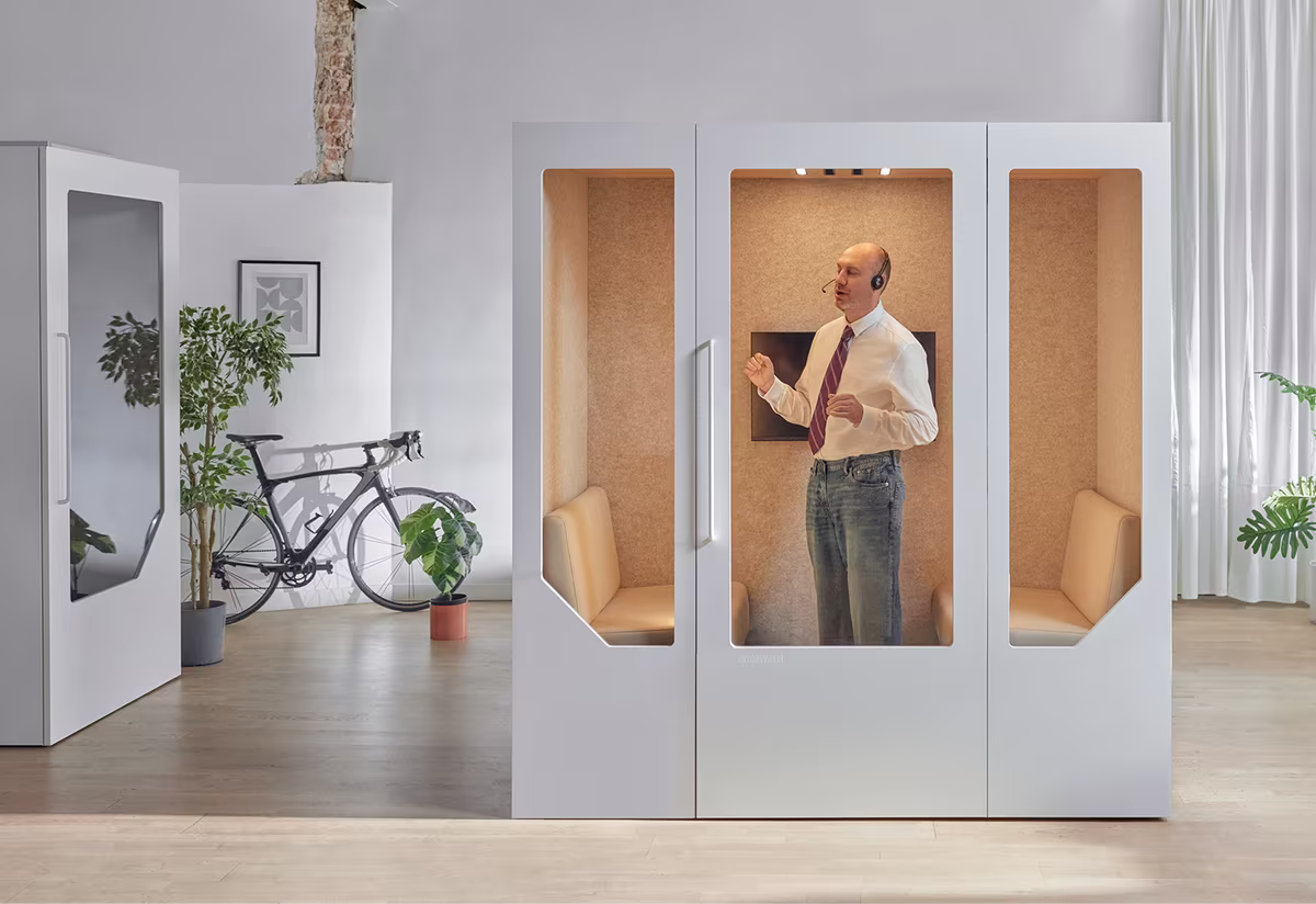 Soundproof office phone booths in a modern workspace
