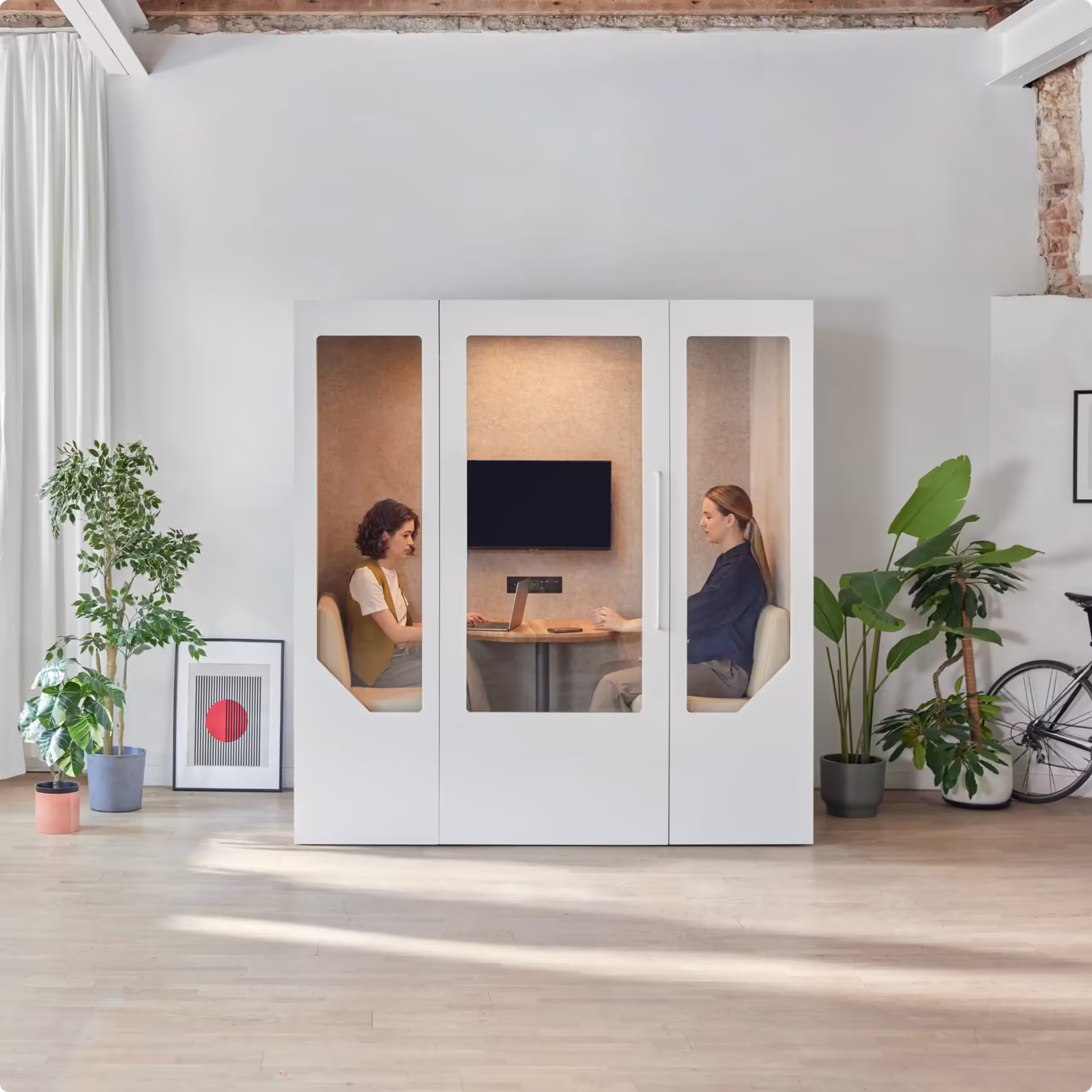 Two people working inside a Persy Booth with fresh air ventilation for extended sessions