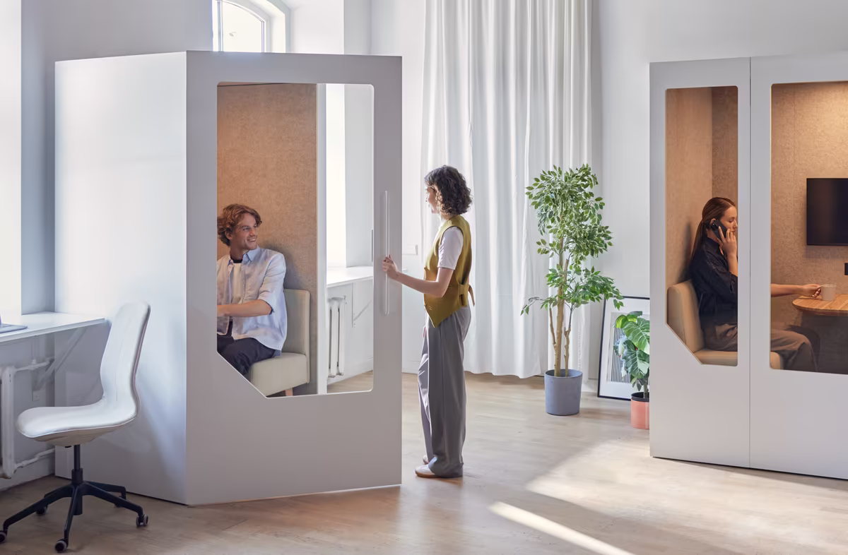 Office pods positioned within an open workspace with clear spacing and access