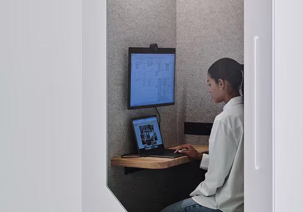Student studying in a quiet private booth on a university campus
