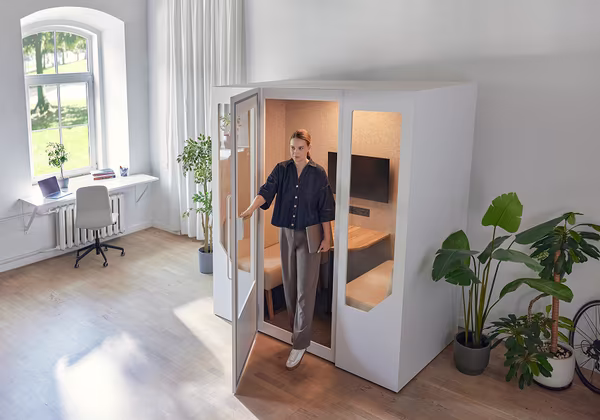 Office pod integrated into a modern workspace while maintaining visual consistency