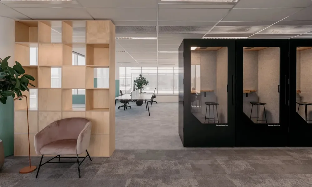 A black Persy booth installed in a modern office