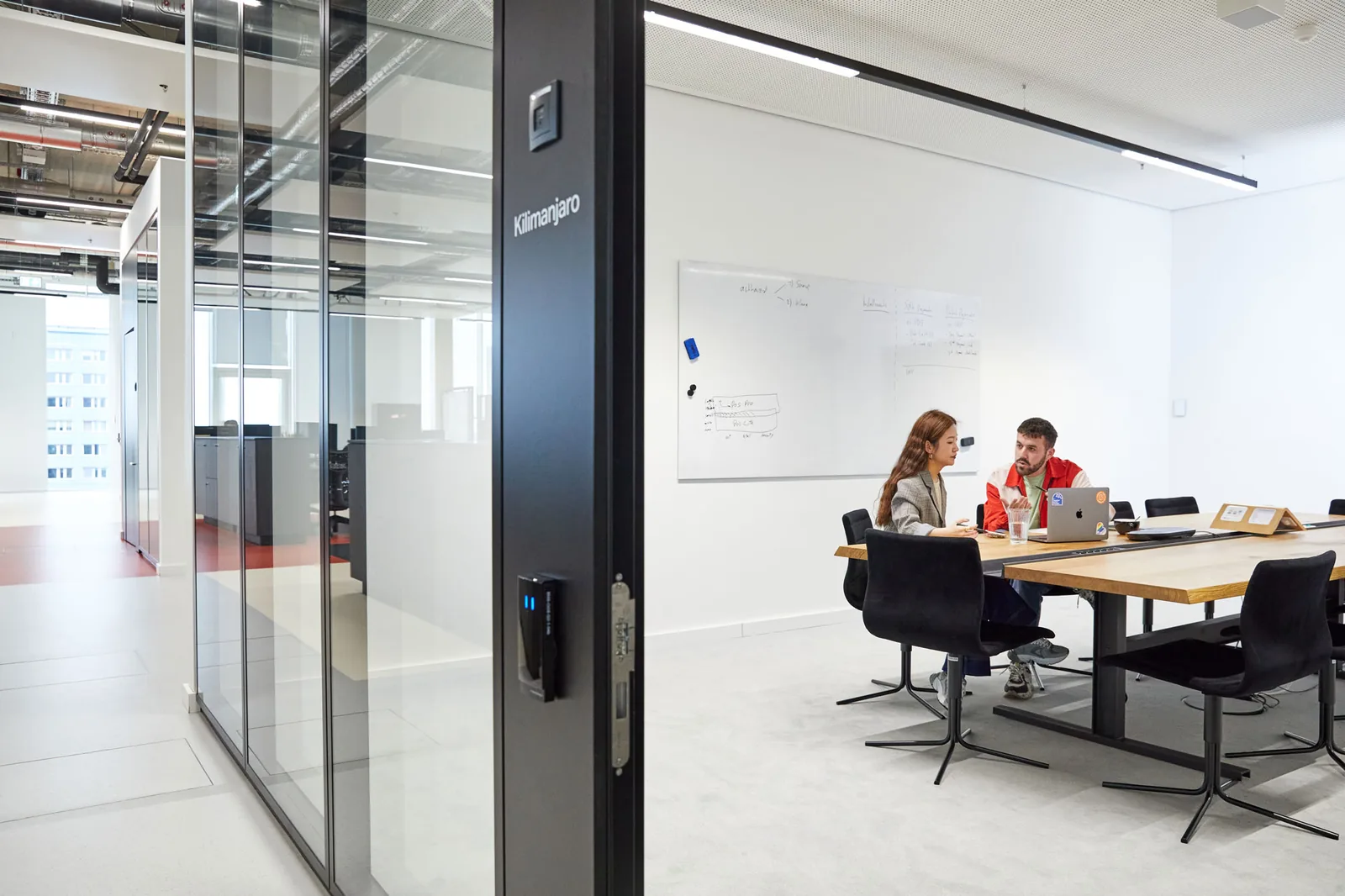 Meeting room and workspace at SumUp’s Berlin office