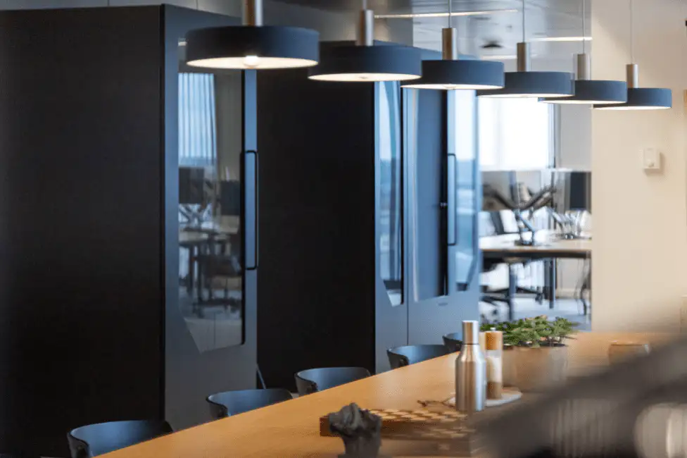 Modern office phone booths by Persy Booths providing private workspaces and acoustic focus zones within an open-plan office environment.