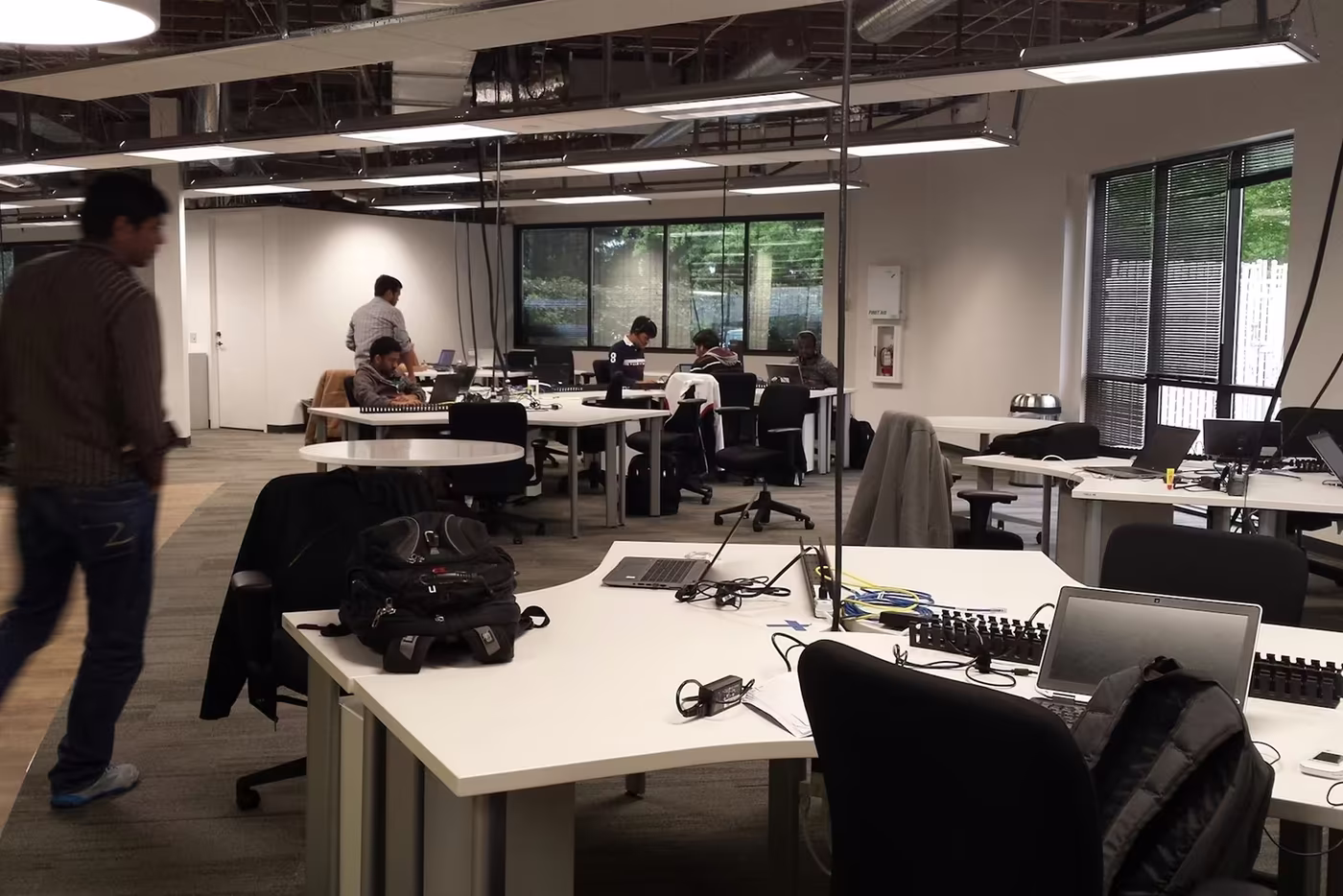 Open-plan office with employees working amid constant background noise